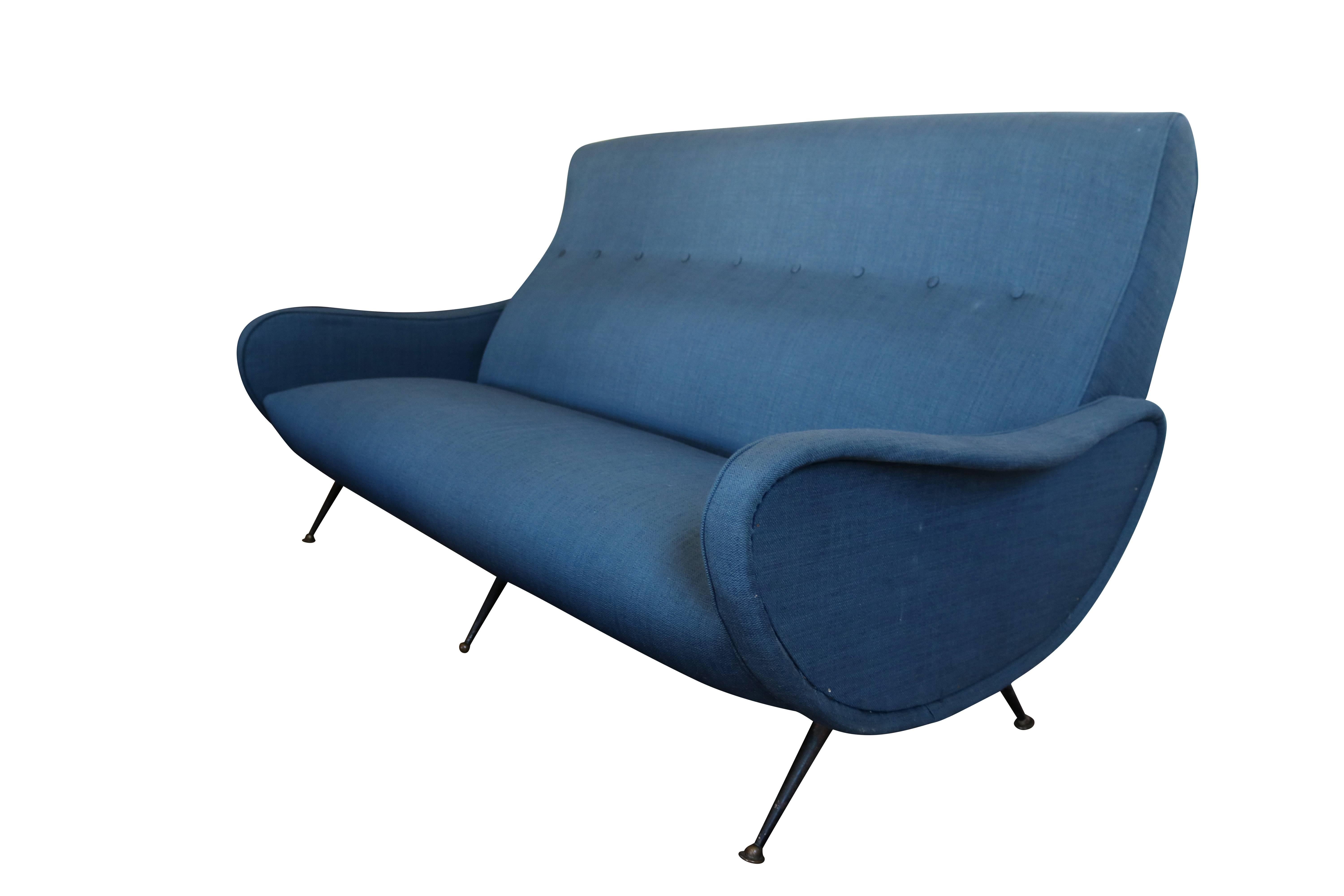 An icon of modern design, Marco Zanuso is probably best known for this sofa design with its distinctive arms. Sofa is sturdy and intact. Upholstery may be original-it does show light wear and some upholstery staples are visible (see arm detail