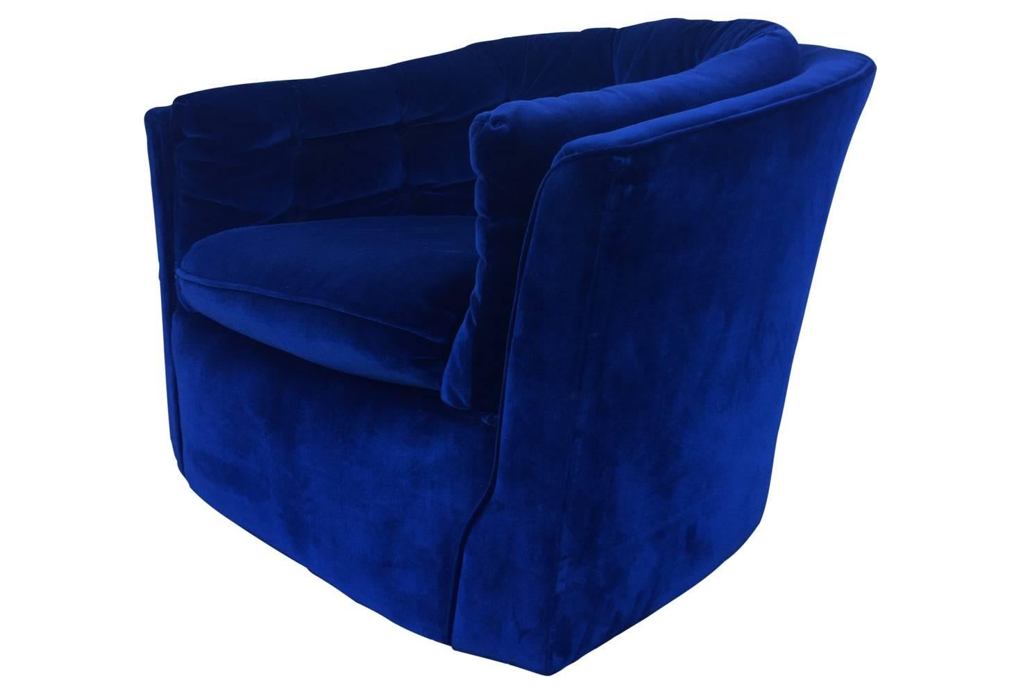 This deep blue color is to die for! Adorable Mid-Century swivel chair in a rich velvet with button detail. Overall great condition, no holes or stains in original fabric.