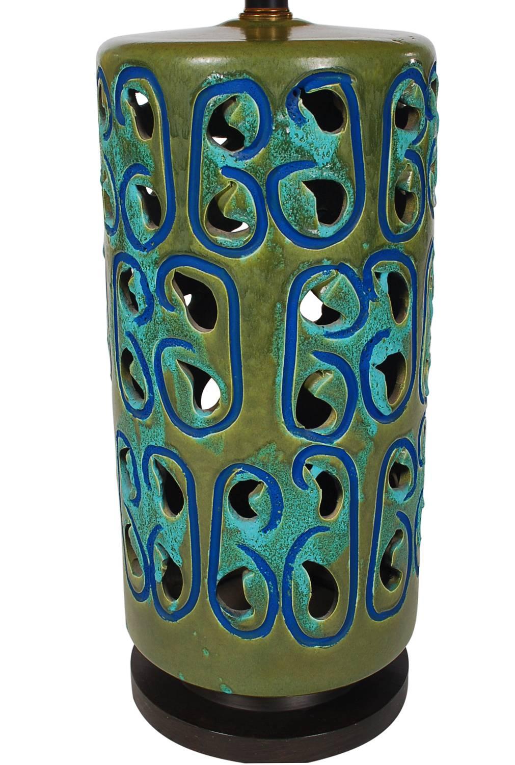 A huge stately glazed ceramic Mid-Century Modern table lamp. A beautiful blue and green color palette with the original shade. Tested, fully working and very well cared for through the years. 

In the style of: Aldo Londi, Bitossi, Raymour,
