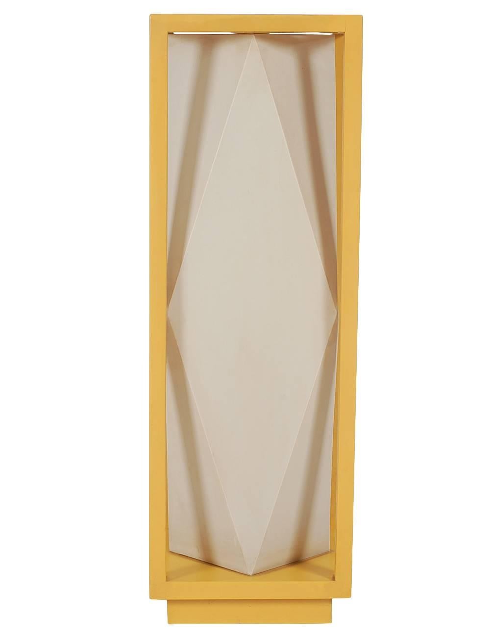 A super fun and modern table lamp. It features a yellow wooden frame with geometric plastic interior shade. Tested and fully working.