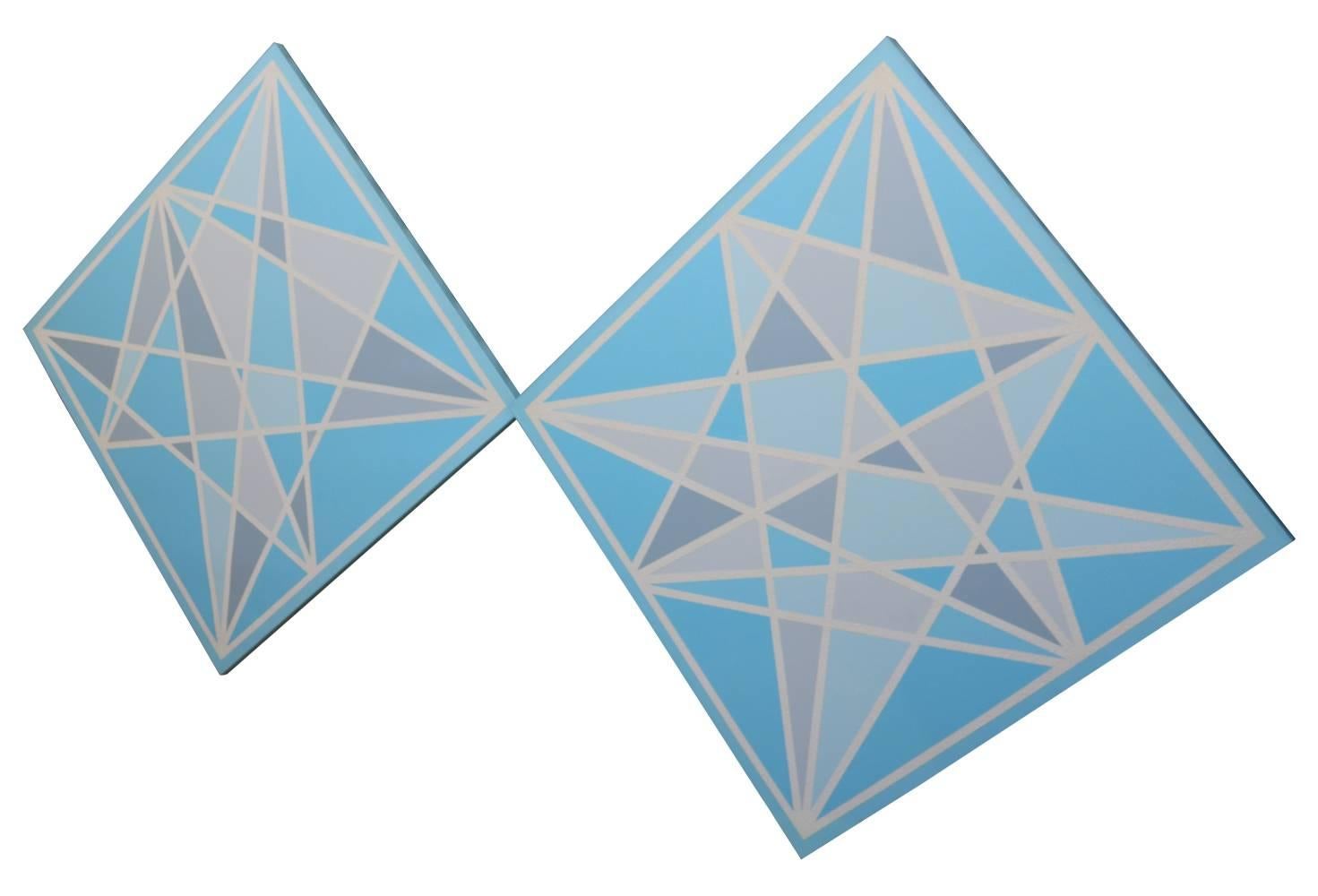 Two large canvases are wired to be hung as diamonds, but could be hung as squares as well. Intersecting lines of white textured acrylic, with smooth areas of blue and grey. Stunning! Signature illegible.
  
