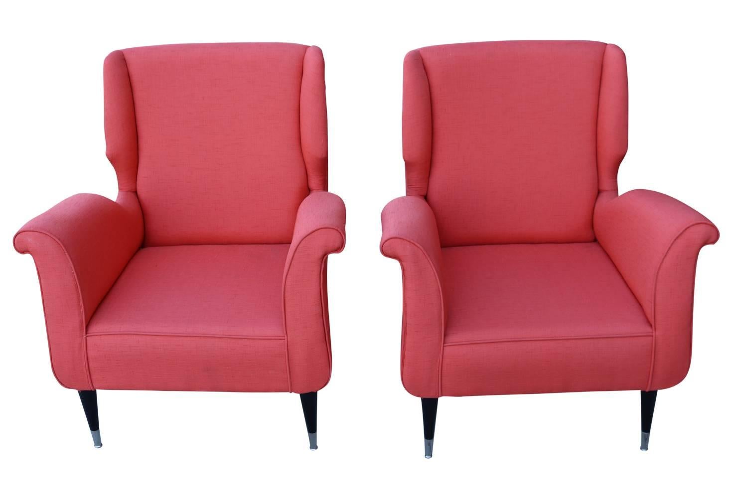 Adorable pair of pink orange (shrimp or salmon) colored vintage armchairs. Awesome sculptural curves, vibrant color, black legs and chrome feet make these chairs real showstoppers! 14.5 inch seat height. Very light wear.