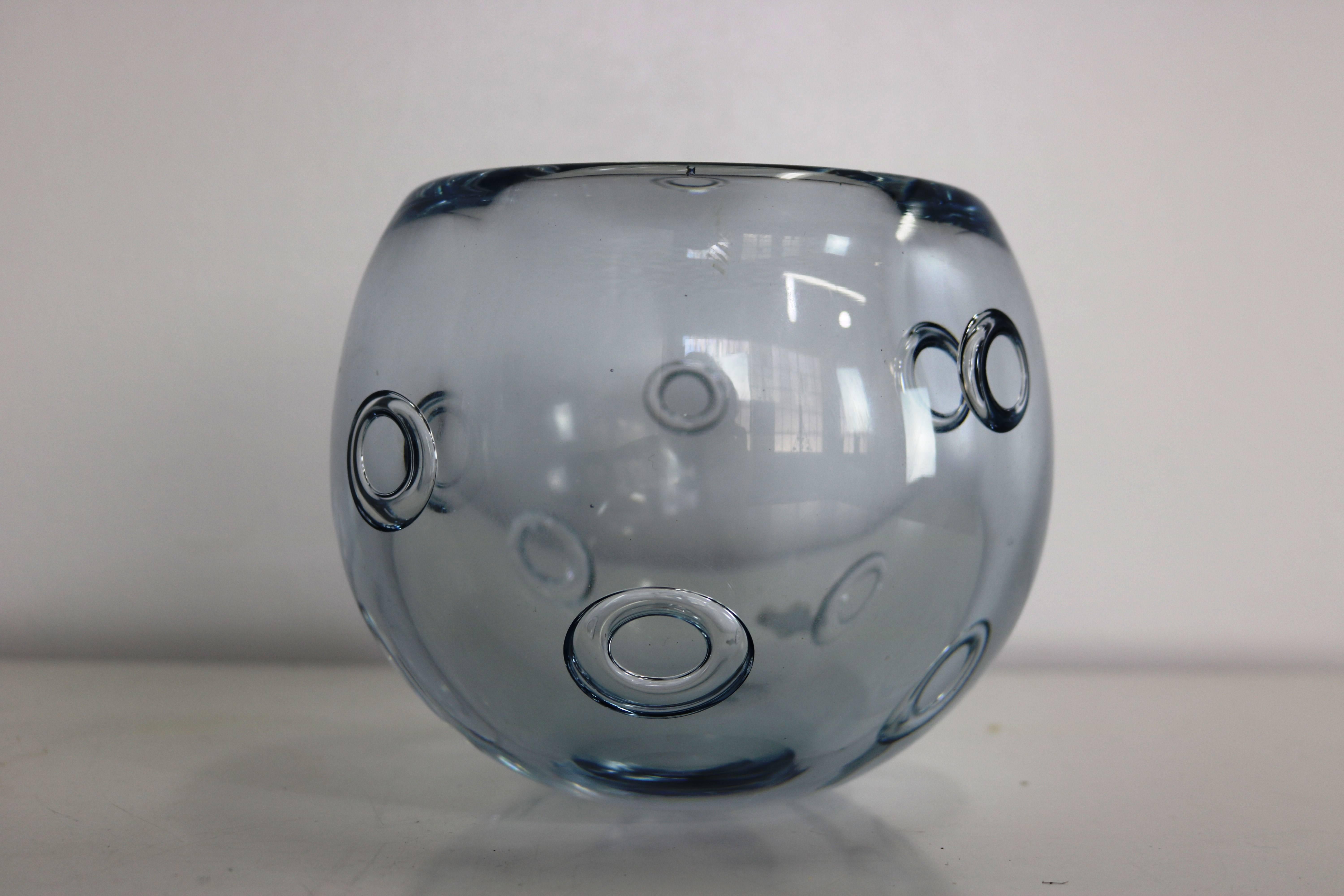 Lovely round glass vase adorned with ring-shaped bubbles throughout in Strombergshyttan's signature blue-silver glass. 

Lindfors Glassworks was founded in 1876 and changed its name to Strombergshyttan in 1933, when Edward Stromberg, former head