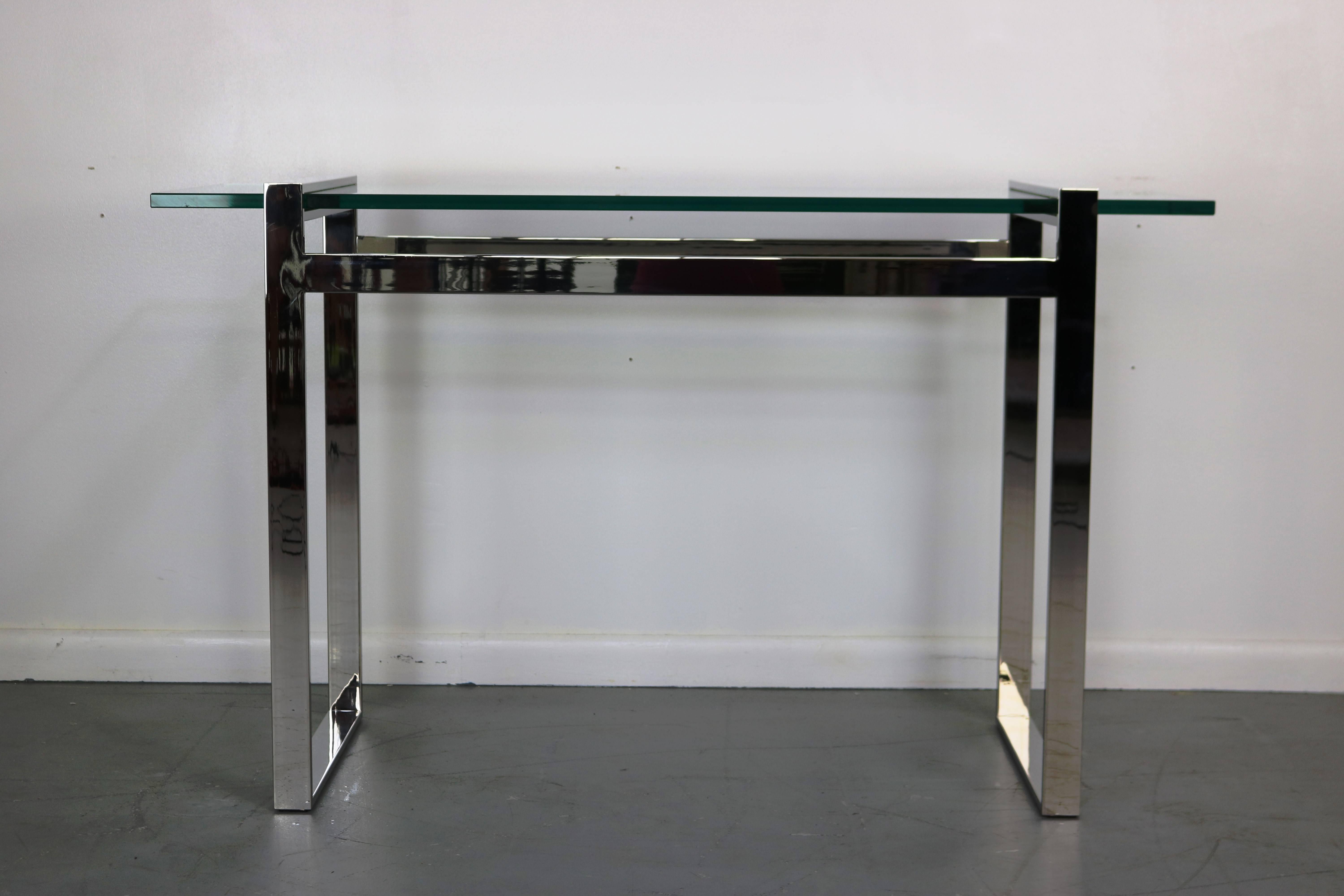 Constructed of flat bar chrome and heavy glass, this console is a showstopper!