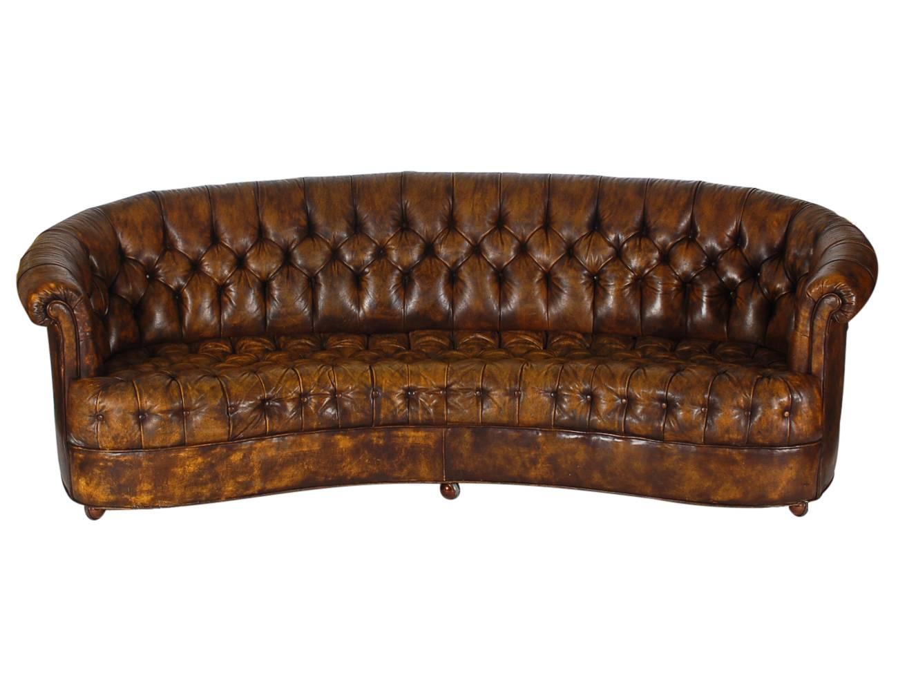 A nice early survivor. A beautiful all original Chesterfield sofa from the 1940s. Original brown leather with a warm amber patina.