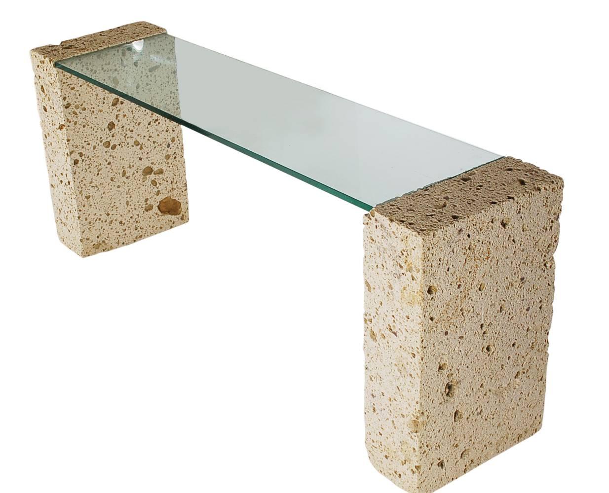 An incredible and organic statement piece. This console table, narrow desk, or sofa table consists of two large pieces of cut coral with a thick inlaid floating glass top. Absolutely stunning piece. 

In the style of Sirmos.