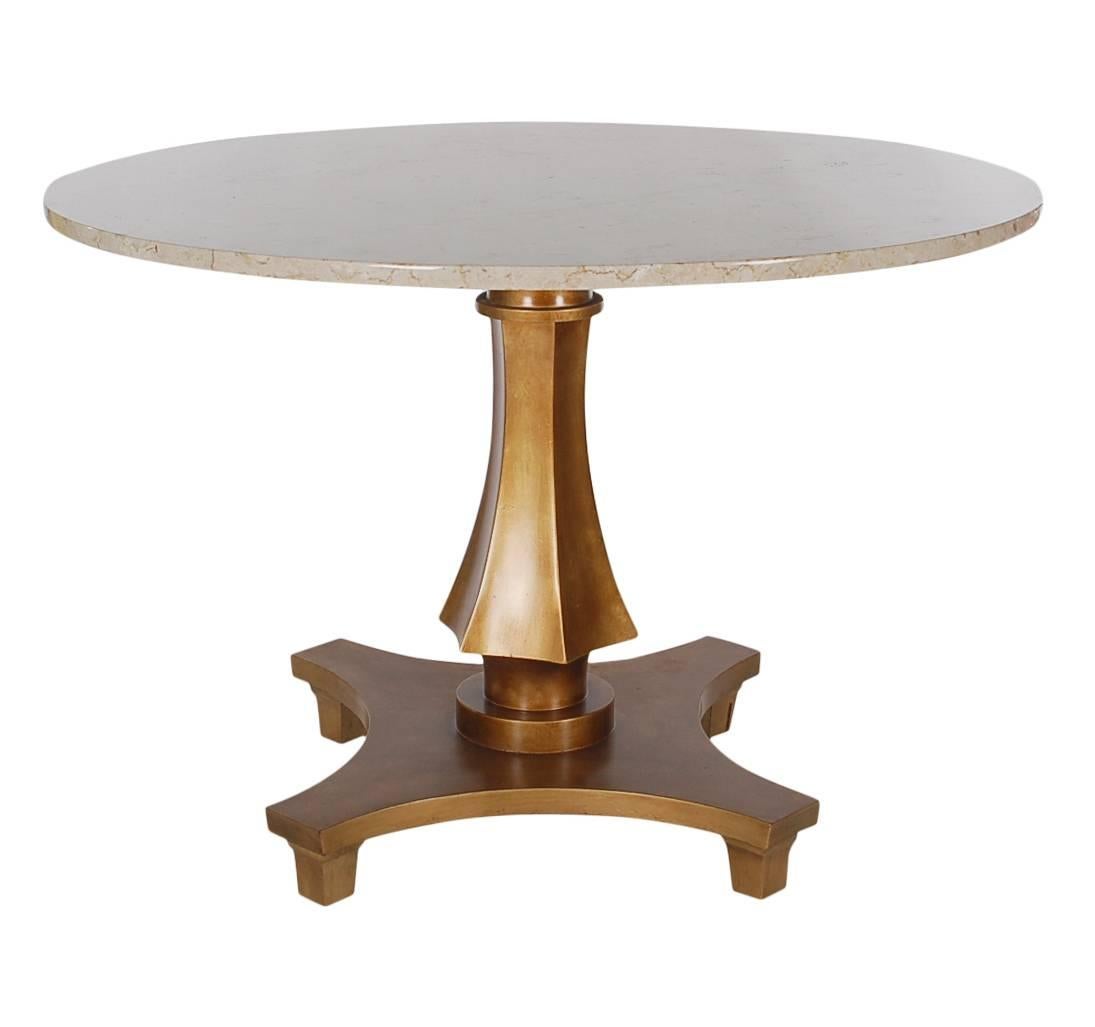 An elegant design produced by Baker Furniture in the 1960s. It features a beautiful gold lacquered base with marble top. Manufactures metal plate on under side.

In the style of Mastercraft.
