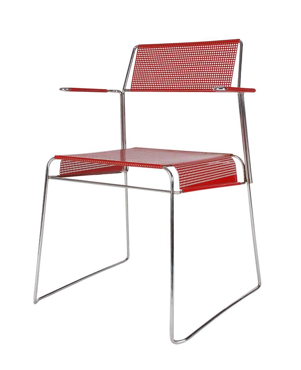 A cool and hip matching set of mesh dining chairs produced in Holland in the 1970s. These feature chrome-plated steel frames with red enameled seats, backs, and armrests.