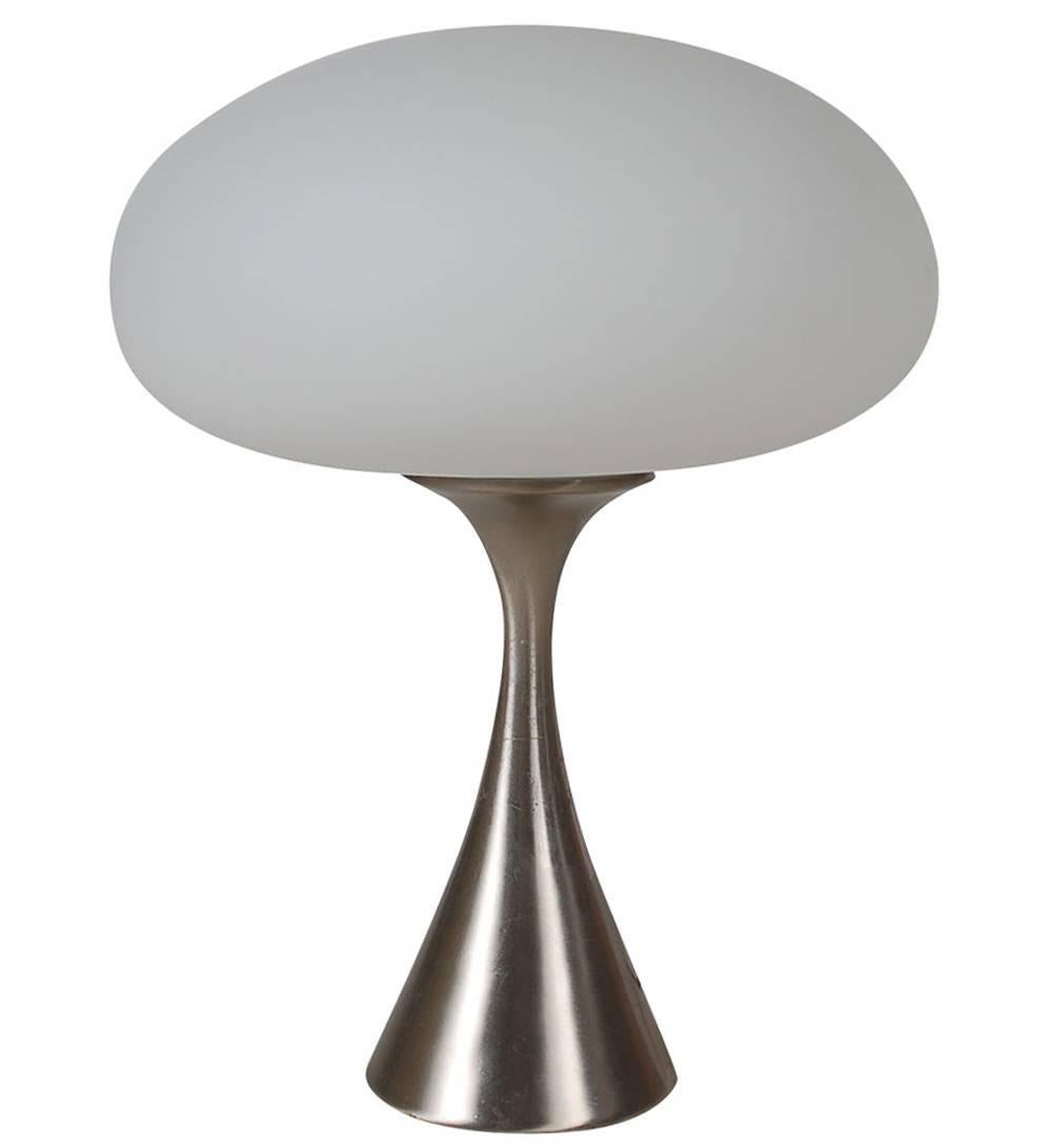 A matching pair of mushroom lamps manufactured by Laurel. They feature white painted cone shaped bases with frosted white glass shades. Both are fully working and ready for use.