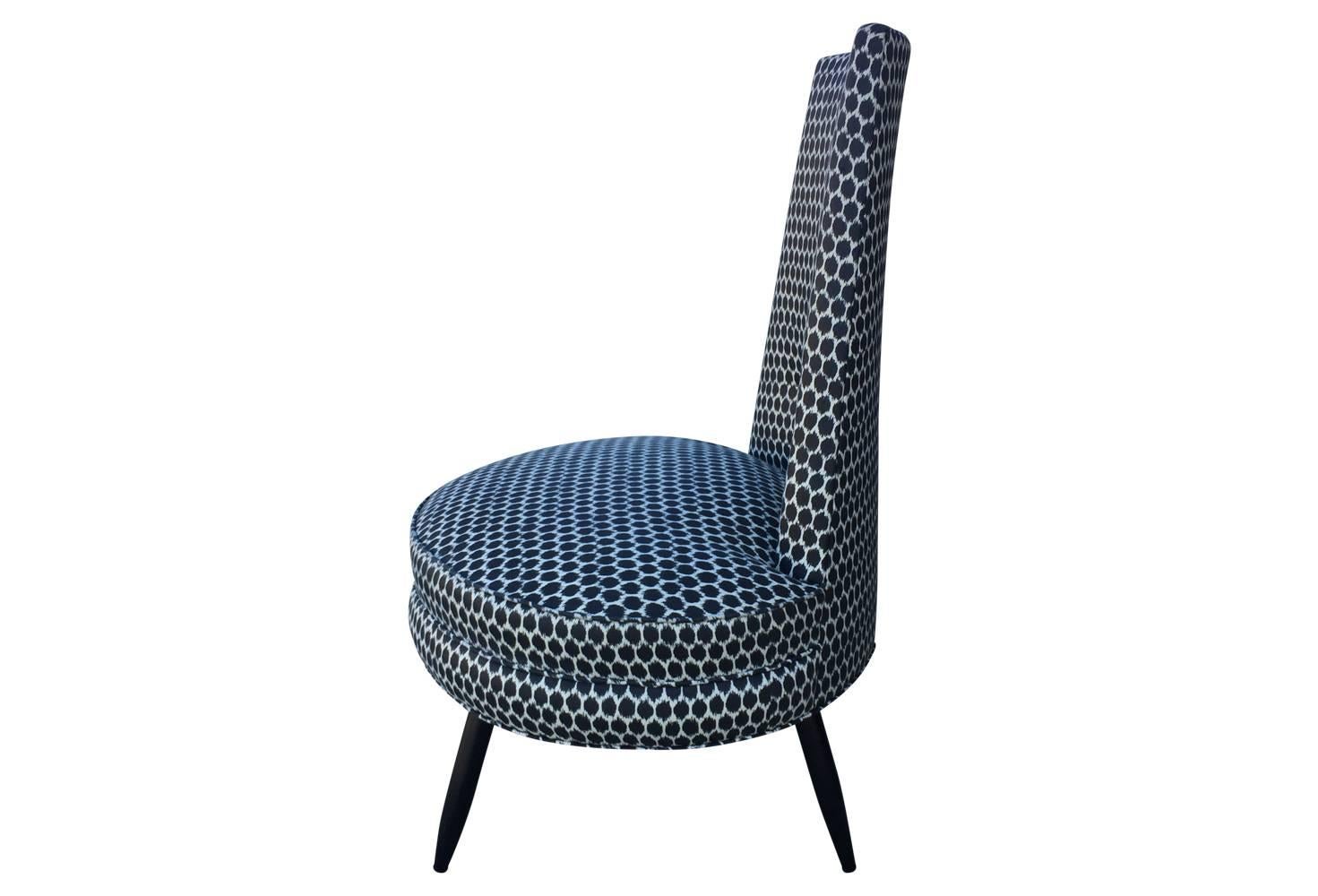 Lovingly restored, this high back chair boasts a unique form and ikat inspired grey and white polka dot fabric. Splayed spindle legs are ebonized.

Measures: 17 inch seat height
21 inch seat depth.