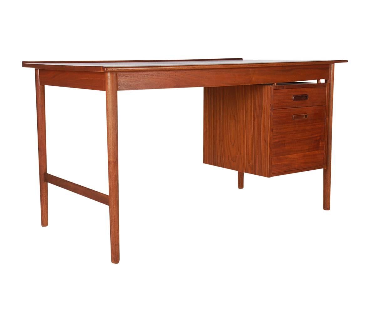 A matching pair of Danish modern desks (Model 541) designed by Folke Ohlsson for DUX. These are uncommon because they have walnut tops. These beautiful desk are priced each. Two are currently available.