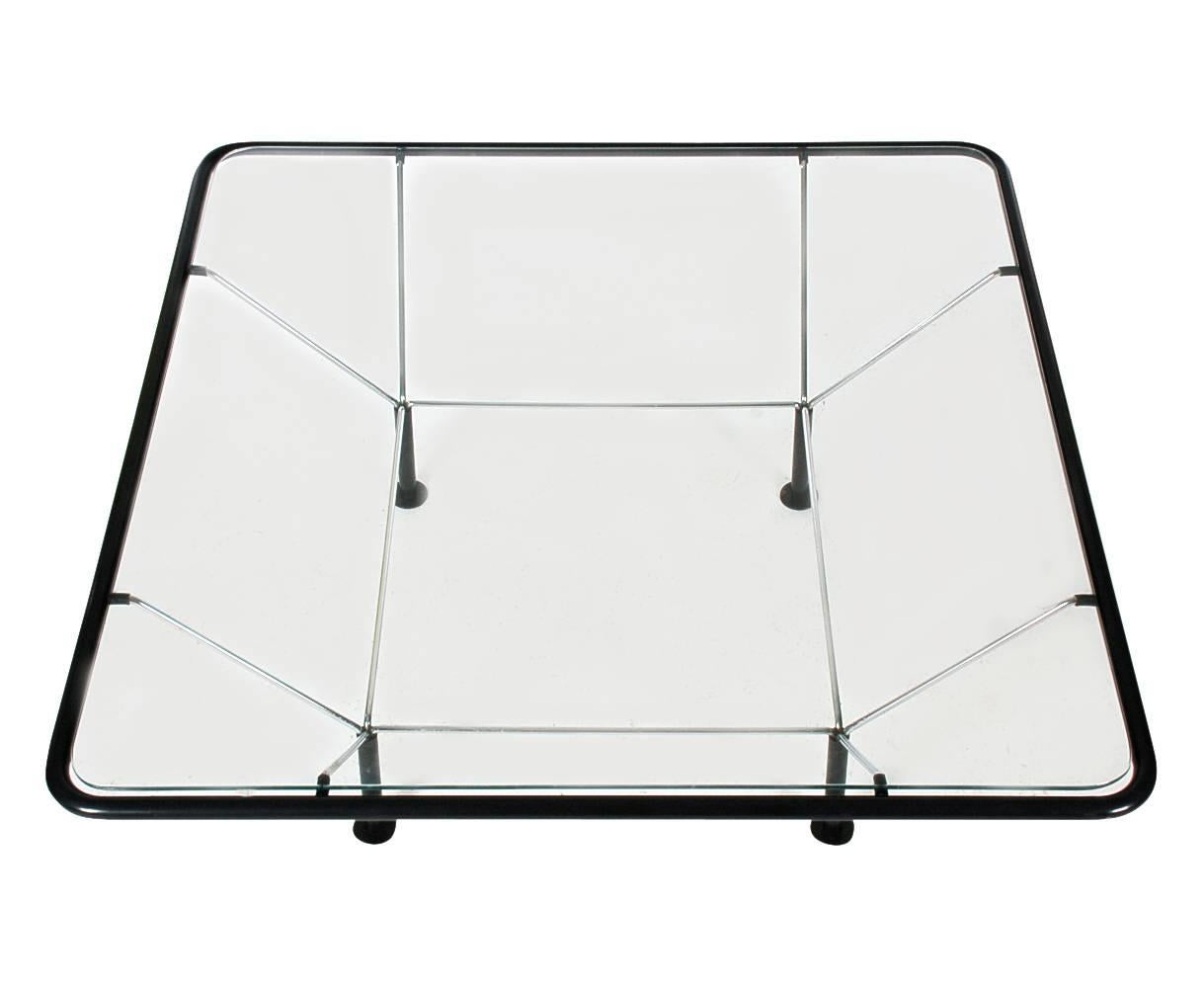 An architectual looking cocktail table very reminiscent of Paolo Piva's Alanda table. It features steel wire construction with black tubular plastic and inlayed clear glass, circa 1980s.