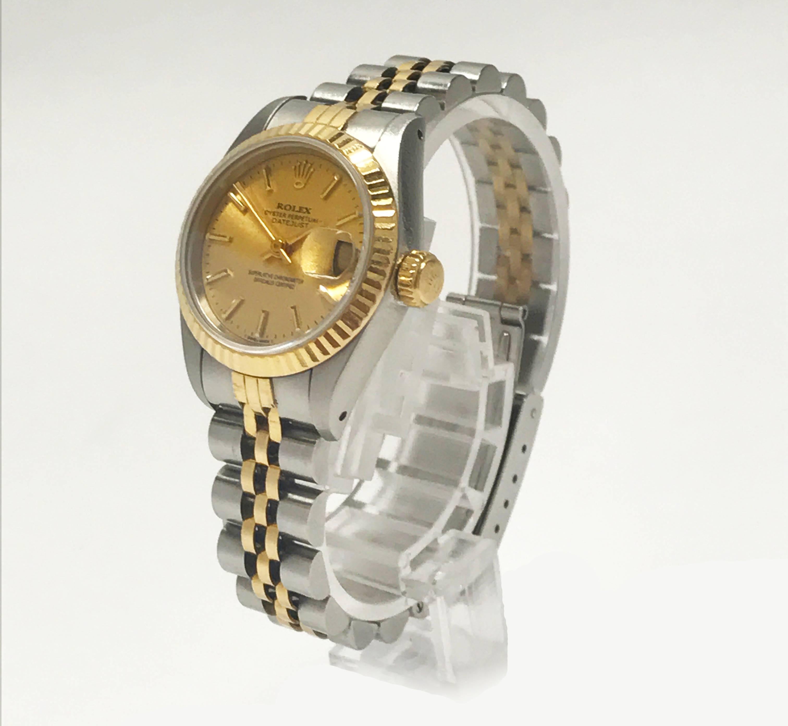 A beautiful ladies estate watch made by Rolex and produced in the 1980's. A timeless and iconic DateJust featuring a two-tone stainless and 18K yellow design. It has a fluted bezel, champagne gold dial, and adjustable jubilee bracelet. Case diameter