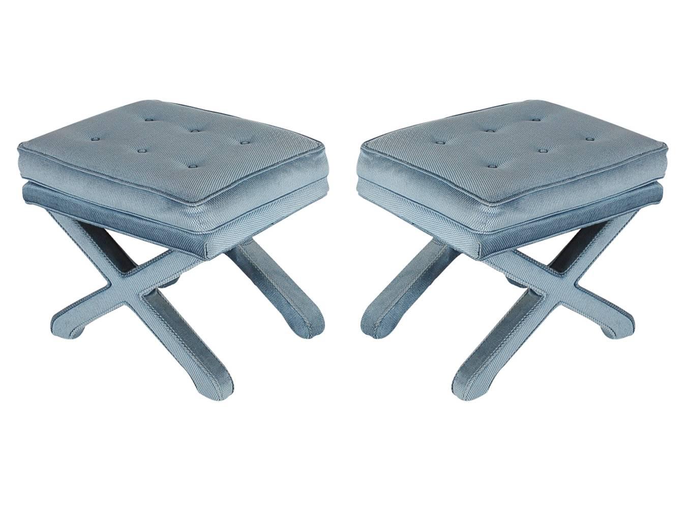 A handsome matching pair of upholstered X-base benches. They feature the original upholstery with button seats. 

In the style of: Billy Baldwin, Billy Haines, Warren Lloyd / Weiman