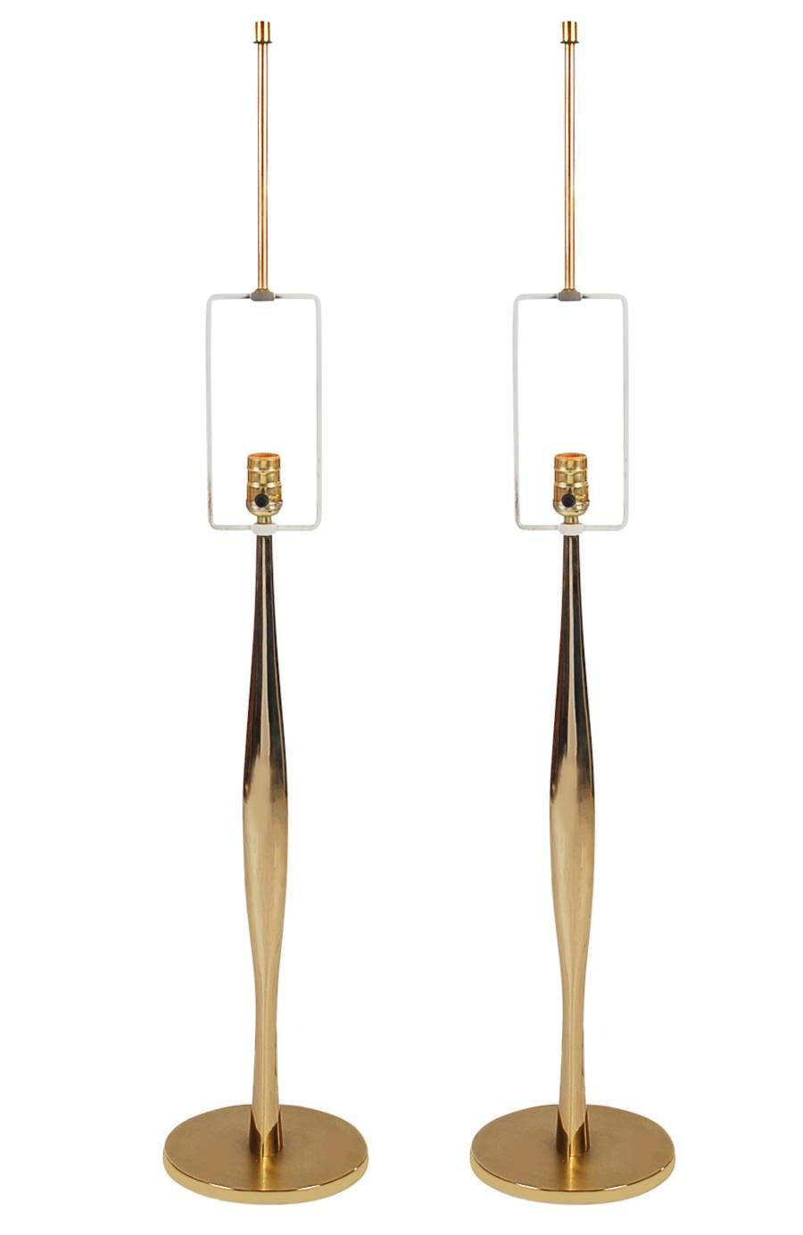 A super sexy pair of tall slender table lamps designed by Laurel Lamp Co. These measure 42.5 inches to the finial, base diameter is 8 inches. Both lamps are tested, working, and ready for use. 

In the style of: Maurizio Tempestini, Stiffel,