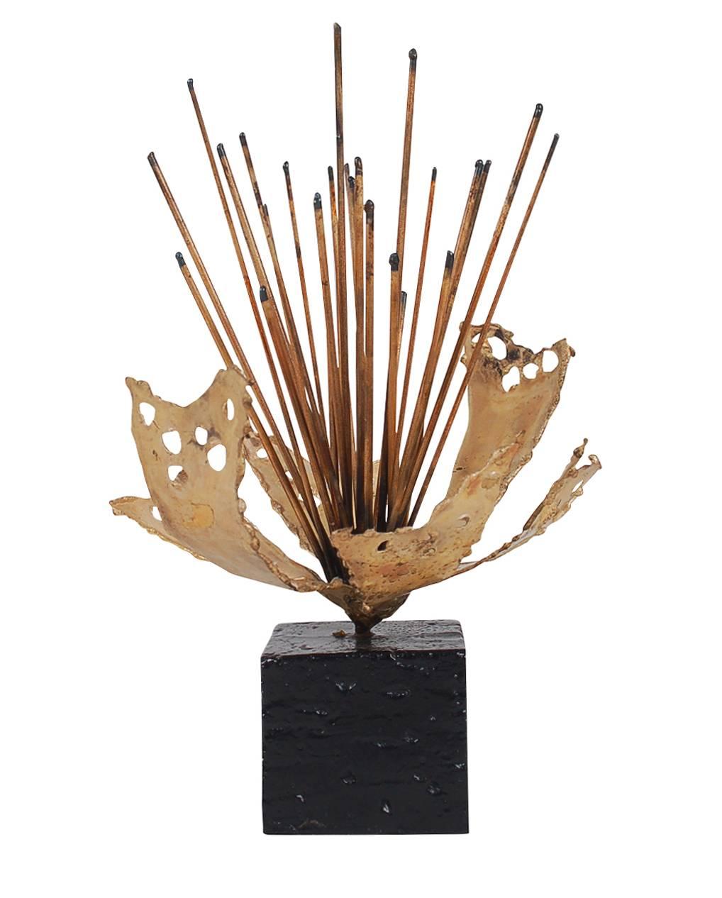 An interesting an early Brutalist table sculpture. It is constructed of welded steel and torch cut brass. Signed and dated on base. 

In the style of: Harry Bertoia, William Bowie, Tom Greene.