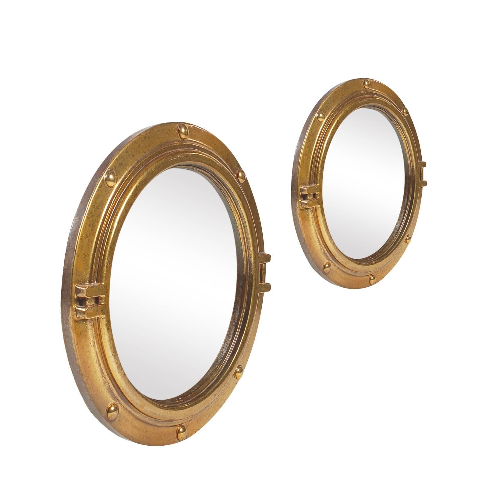 A nice matching pair of gold lacquered porthole style mirrors. Both are in excellent condition and ready for use.