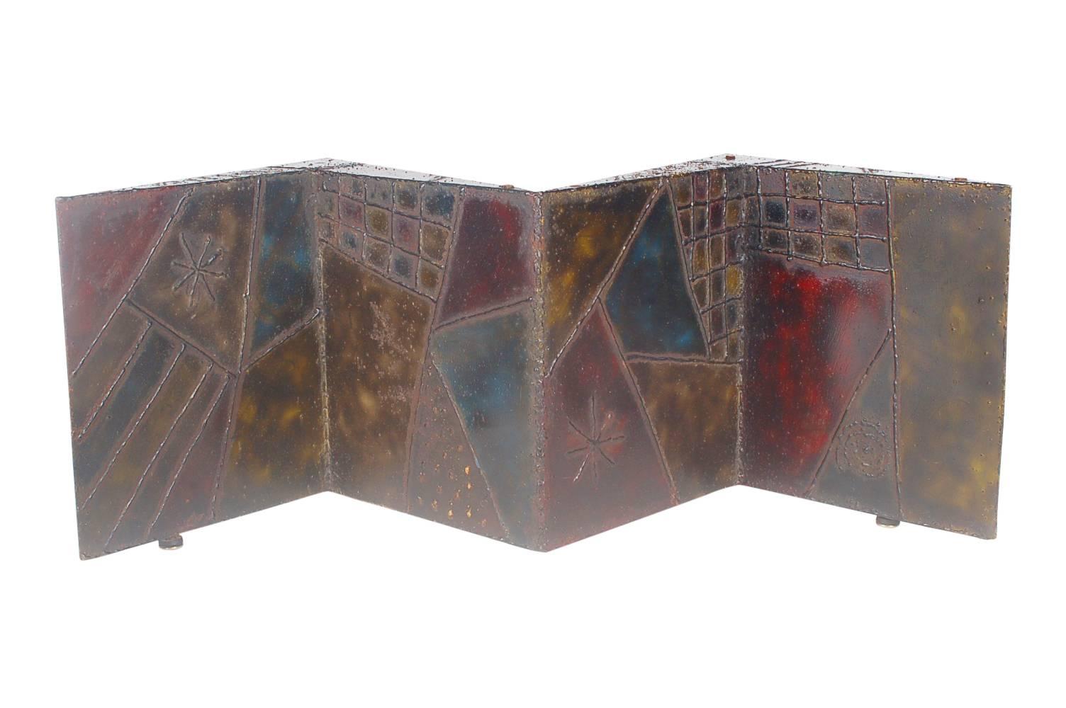 A welded studio coffee table created by renowned artist Paul Evans in New Hope PA. This piece is one of his less common designs with a welded signature PE69. 

Works well with: Harry Bertoia, Tom Greene, William Bowie and Curtis Jere Designs