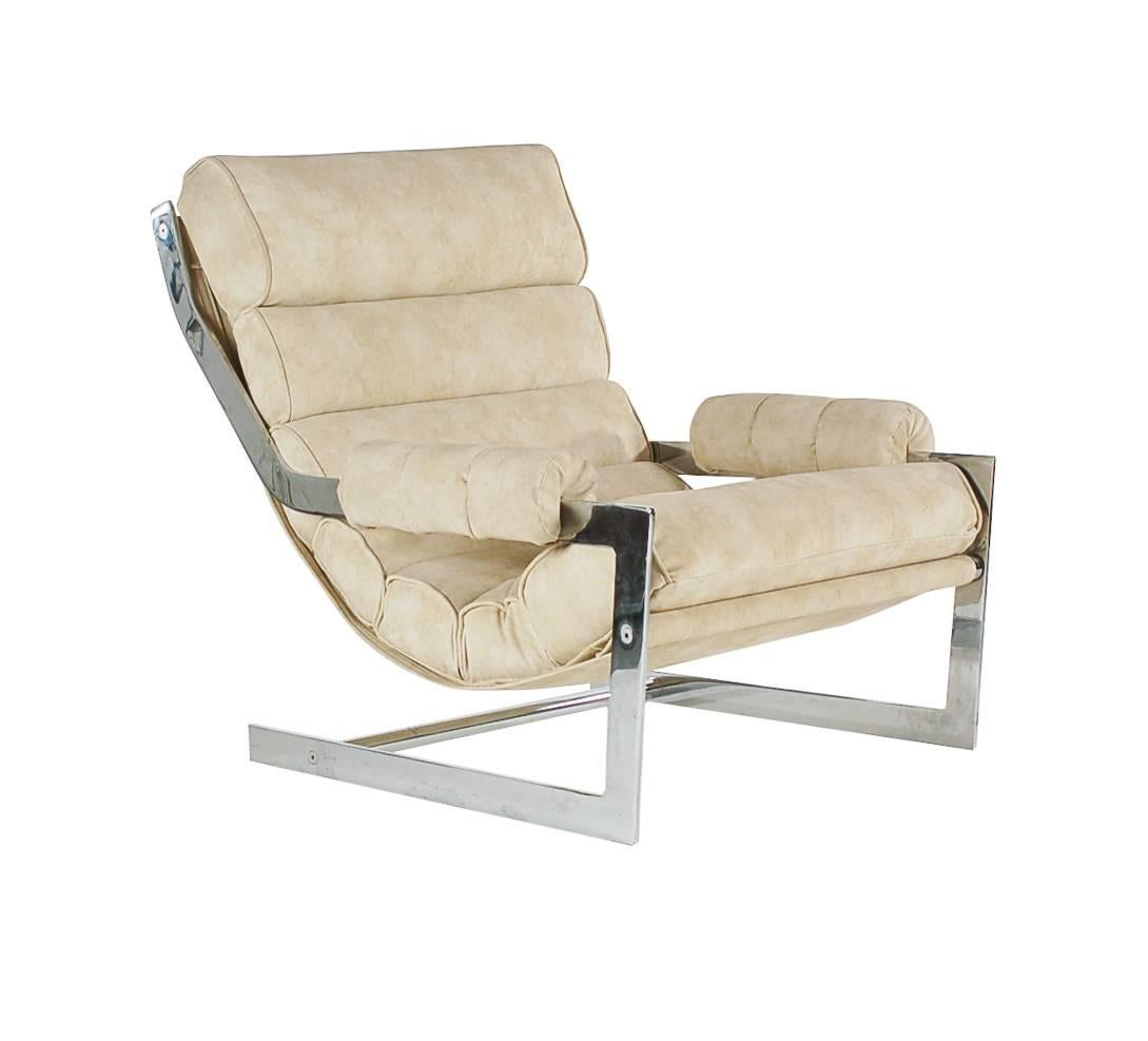 A chic and luxurious scoop lounge chair and ottoman set. This set features a heavy solid chrome frame and ribbed suede upholstery. Very clean and ready for immediate use. Ottoman measures: H17 D21 W27.
