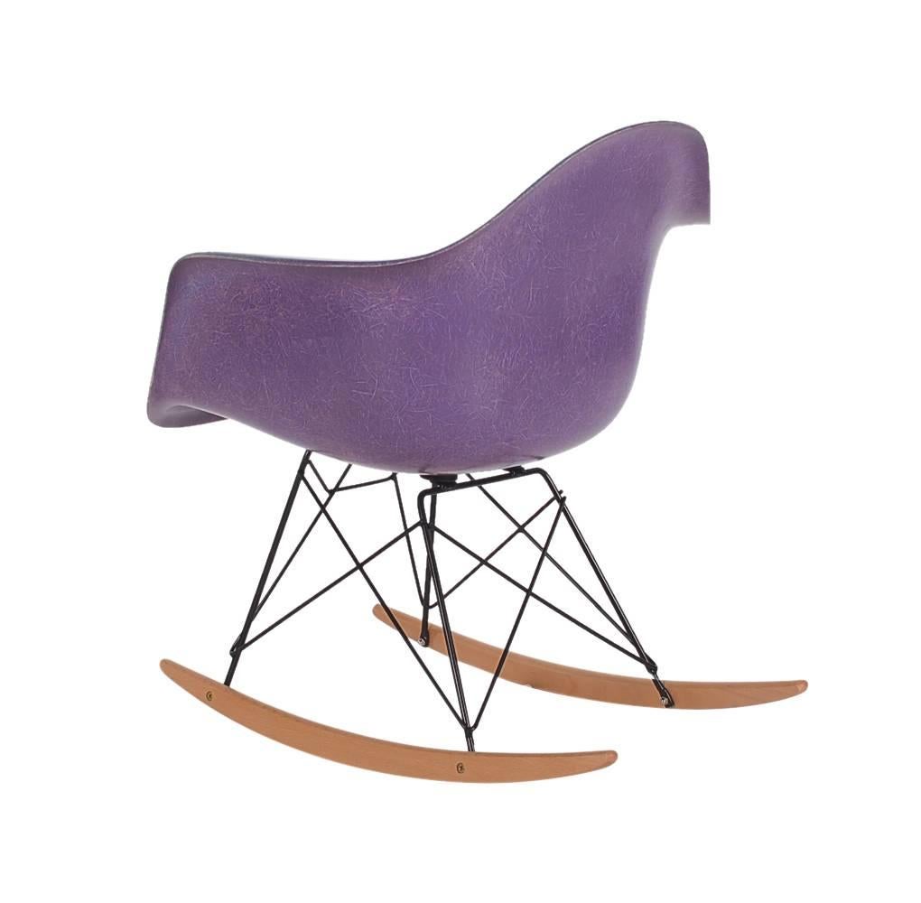 Purple is known to be the rarest color to collectors worldwide. Here we have a vintage arm shell produced by Herman Miller in the early 1970s. Rocker base is a newer production, chair seat is vintage. Embossed logo.