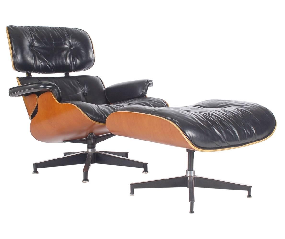 One of the most iconic chairs in the world, the Eames lounge chair and ottoman. A beautiful example featuring cherry ply shells and Classic black leather. Very well cared for through the years and ready for immediate use. Ottoman measures: H 17, W