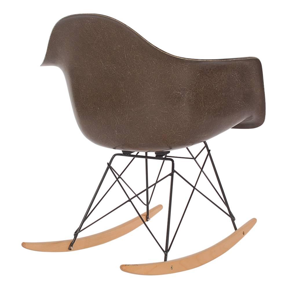Here we have an iconic design Classic from the Mid-Century Modern period. This vintage fiberglass shell chair was designed by Charles Eames and produced by Herman Miller, circa 1972. Very hard to find chocolate brown color. The chair seat is vintage