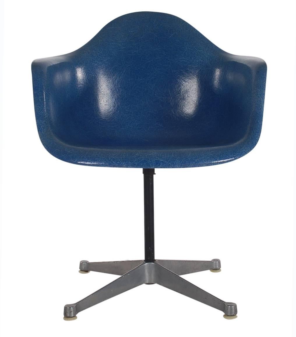 Here we have an iconic design Classic from the Mid-Century Modern period. This vintage fiberglass shell chair was designed by Charles Eames and produced by Herman Miller, circa 1972. Six chairs in three very hard to find colors. These chairs are