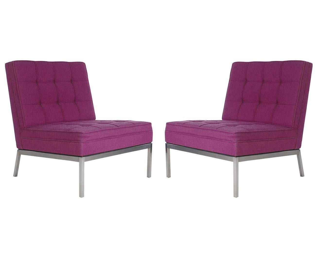 A sharp looking matching pair of slipper chairs designed by Florence Knoll and produced by Knoll Associates. They feature stainless steel frames and purple tweed upholstery.