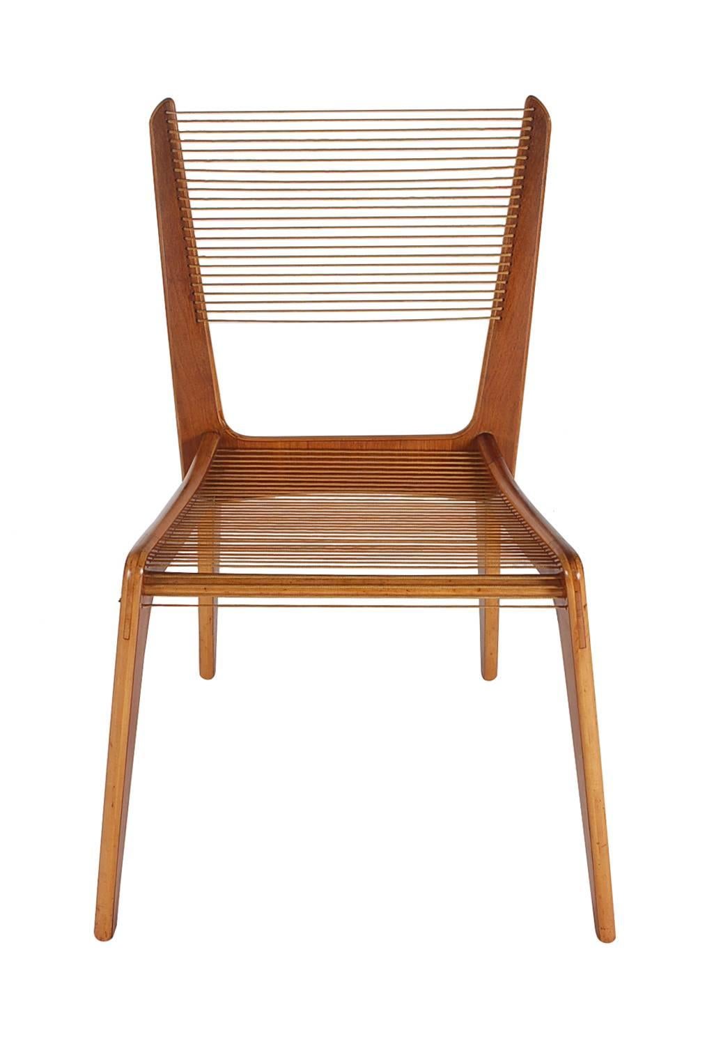 An early and very uncommon set of cord chairs designed by Jacques Gillion and produced in Canada in the 1950s. They have a beautiful two tone wood design, and are unexpectedly sturdy and very comfortable.
