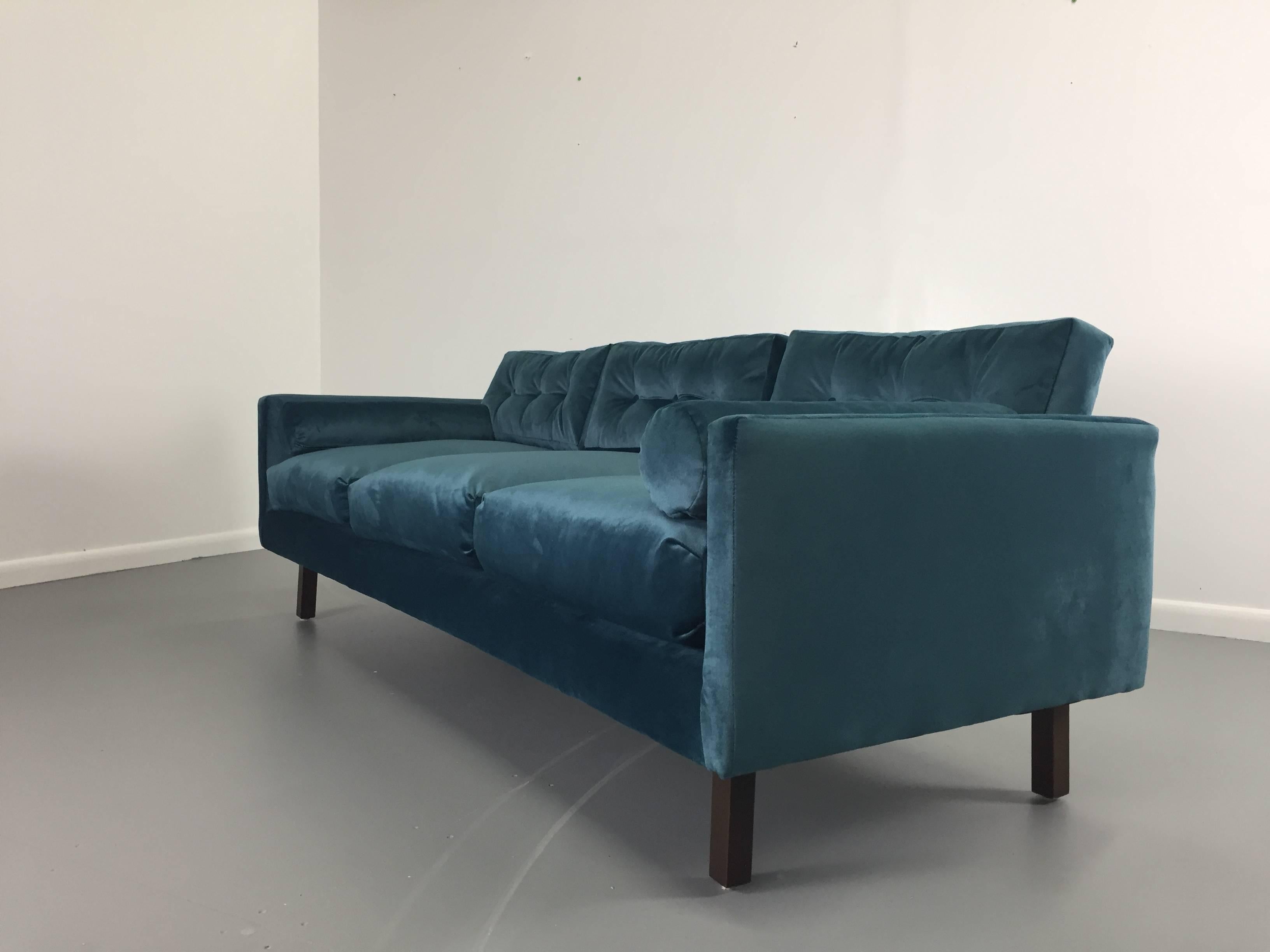 This beautiful 1960s Harvey Probber sofa has been completely refinished and reupholstered in a lovely peacock colored velvet and fitted with down or foam filled pillows.