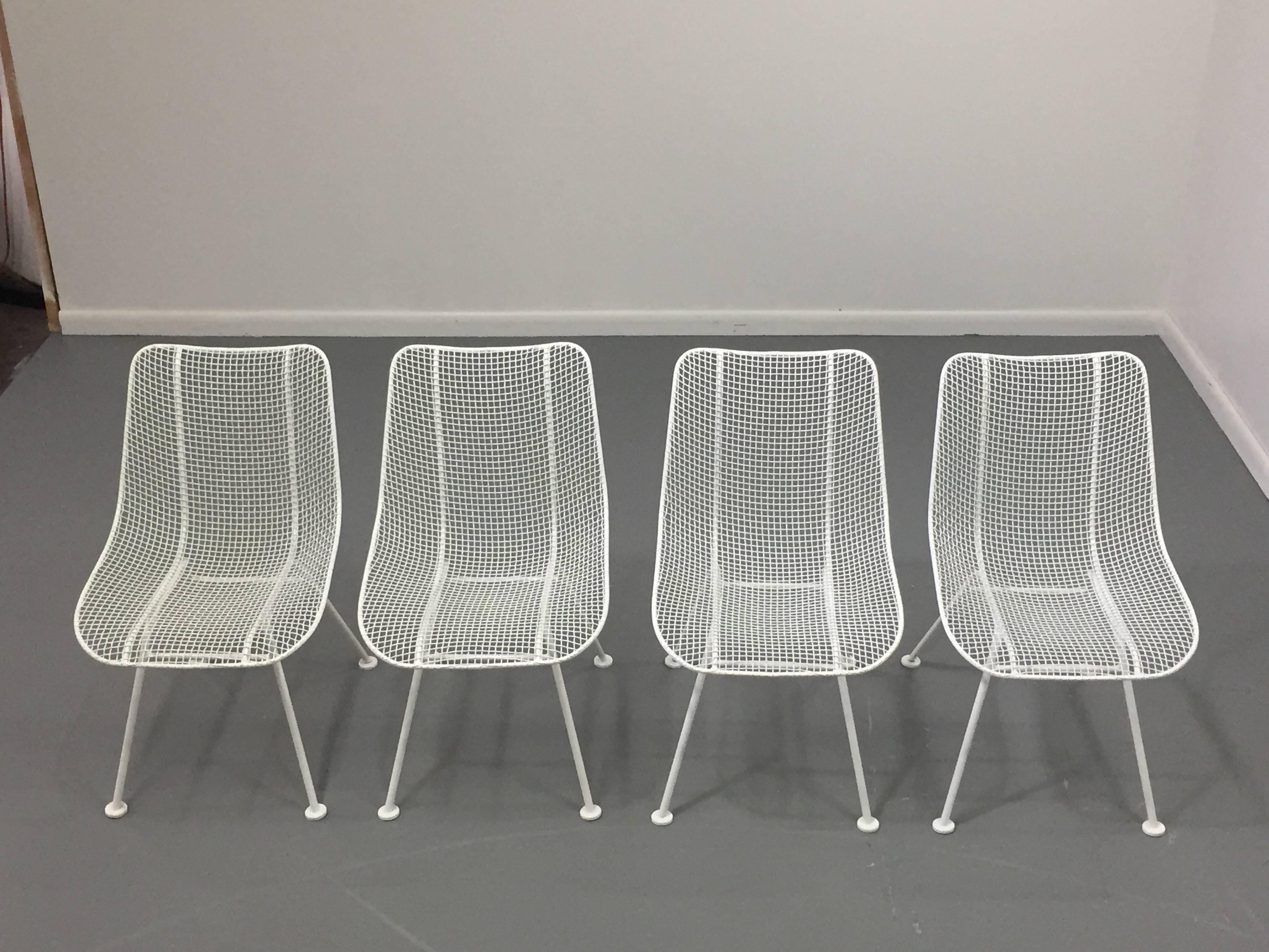 Set of four Russell Woodard side chairs newly powder coated and in beautiful condition.