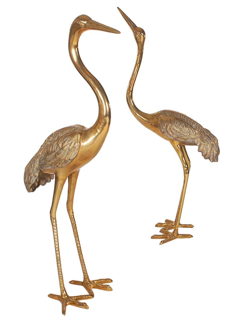 An attractive complementing pair of brass crane statues. The feature heavy brass cast forms with great detailing. Price includes the pair.
