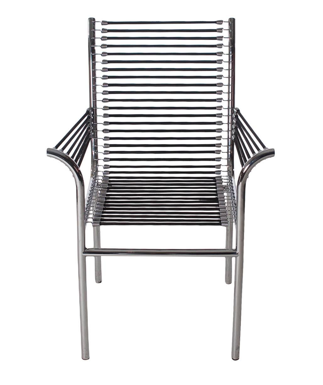 1980s edition of the Sandows chair designed by Rene´ Herbst. An iconic Classic from the Bauhaus period. The feature polished stainless frames with elasticated cords. Plenty of extra cords included with the chairs.