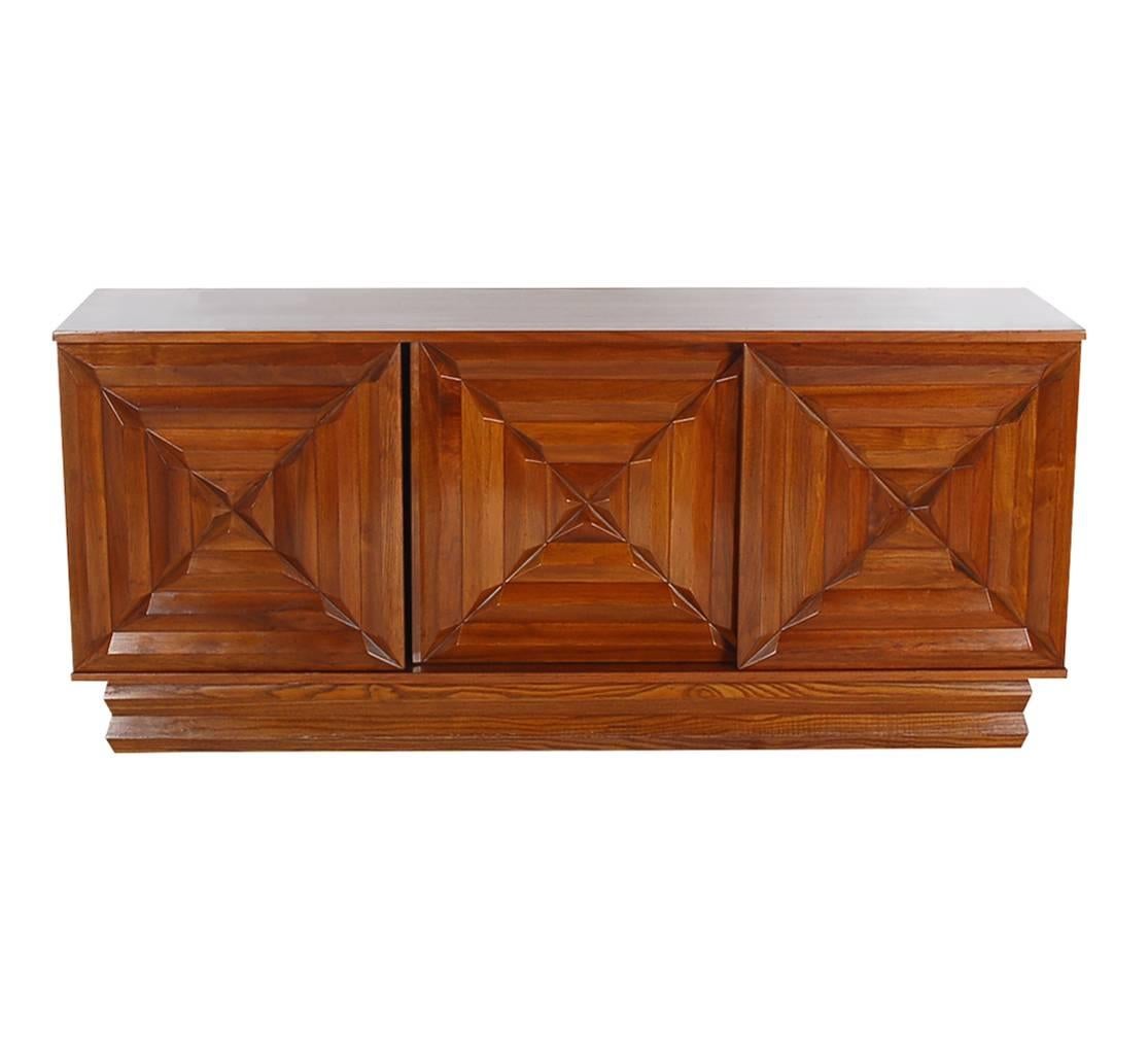 A beautiful well made cabinet from the Mid-Century, 1960s. It can easily be used as a credenza or dresser. It features walnut construction with plenty of storage. I the style of George Nakashima.