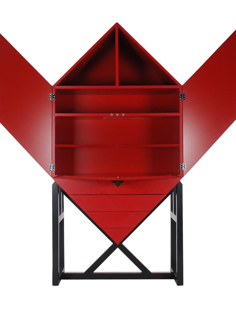 A gorgeous postmodern designed cabinet, circa 1980s. It features extremely well built red cabinetry with ingenious doors and drawer design. In the manner of Ettore Sottsass for Memphis.
