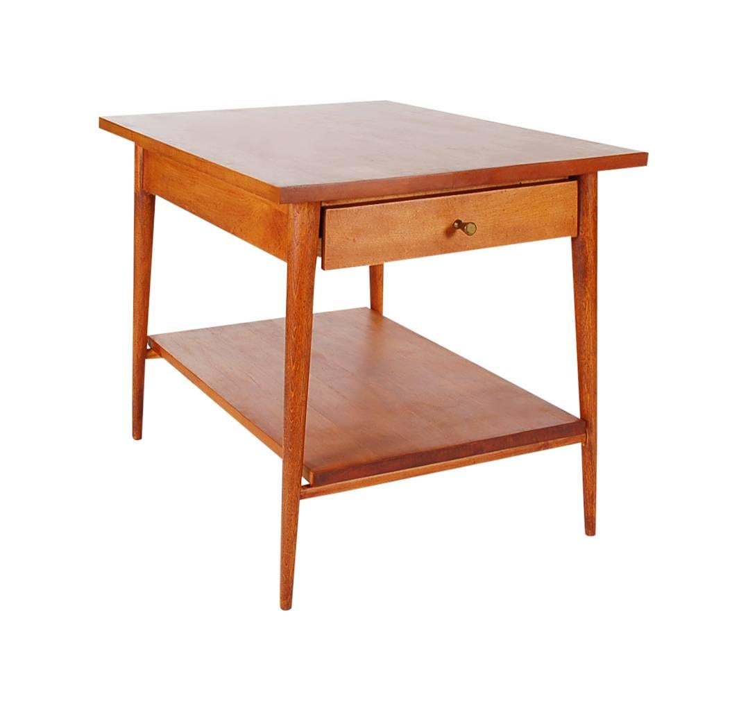 A simple design by Paul McCobb for his Planner Group line in the 1950s that was produced by Winchendon Furniture. This table features solid maple construction and in well cared for condition.