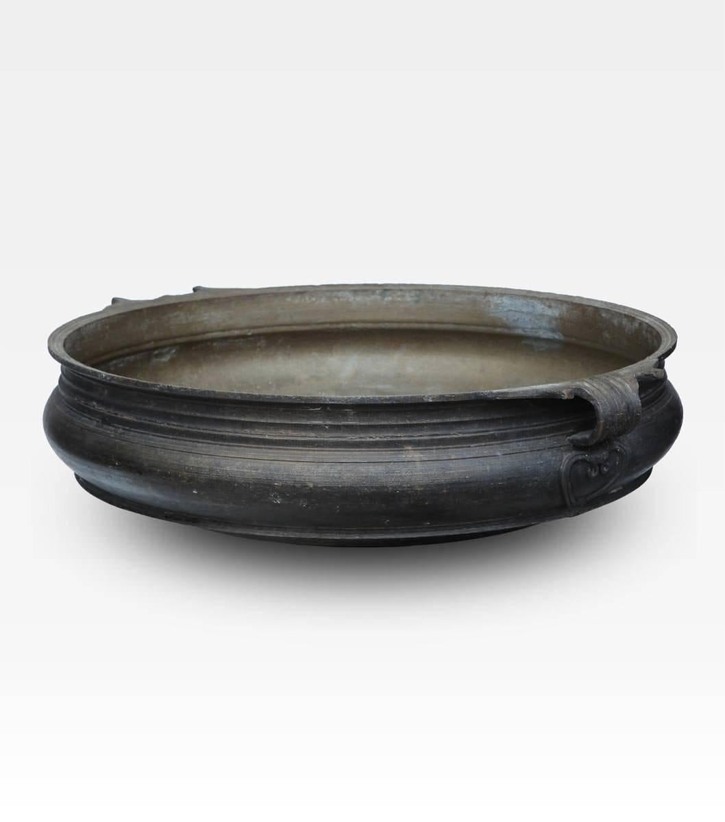 Beautiful Indian basin, it is a precious lost wax bronze casting, originally used for baking Prasada (spiritual food) during kathakali celebration. The bowl is finely decorated also with the round handles which make it even more beautiful. Today it