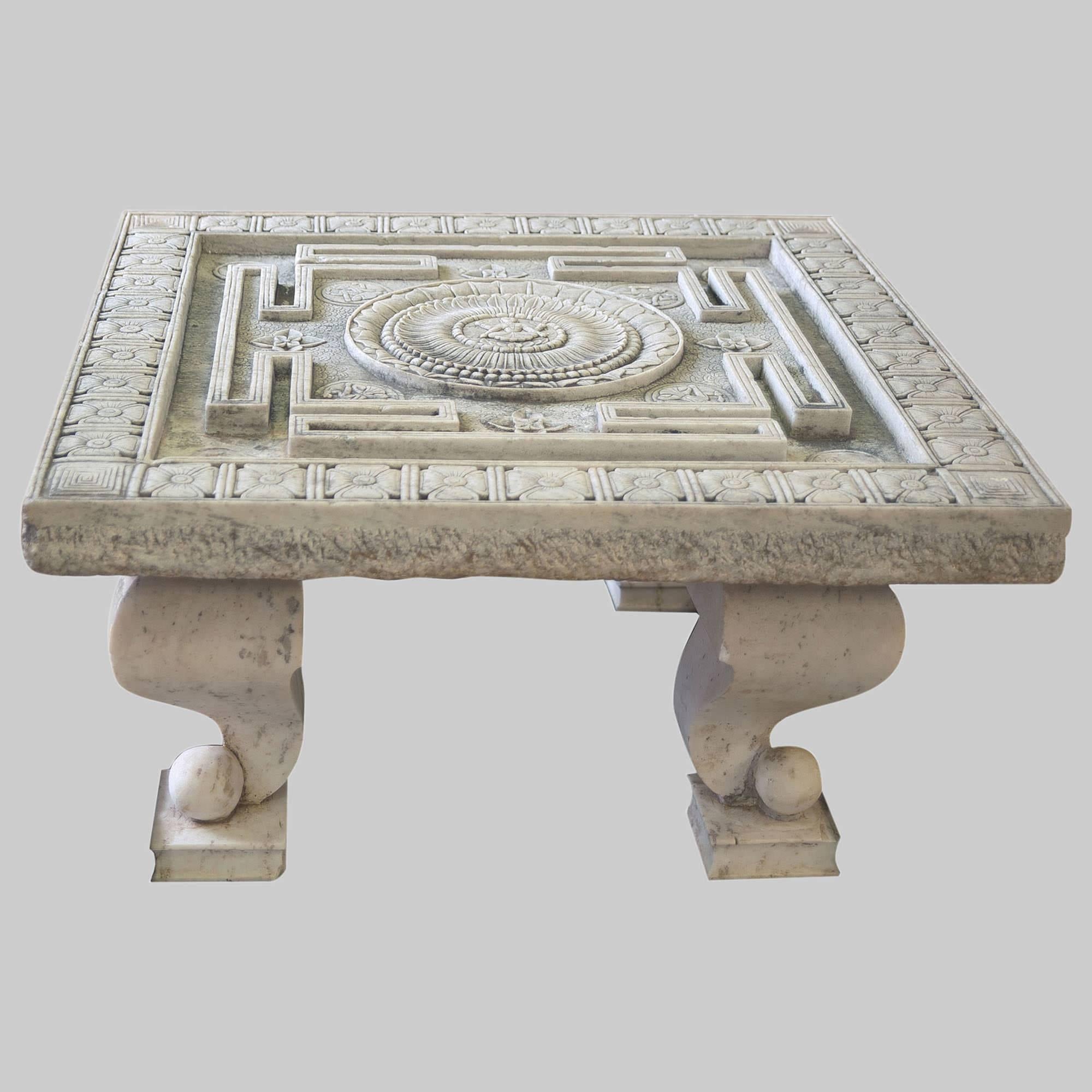 Precious white marble fountain. The fine work of carving shows a beautiful yantra, ancient geometric representations, which promotes meditation. The word yantra means in fact vehicle. Yantra encloses a beautiful lotus flower, where at the center,