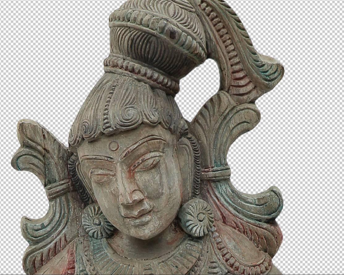 Ancient sculpture made of precious teakwood. The sculpture depicts an Apsaras, these female figures, similar to the nymphs, have unearthly beauty, special power over fate and the ability to change their appearance at will. Handmaidens at Indra's