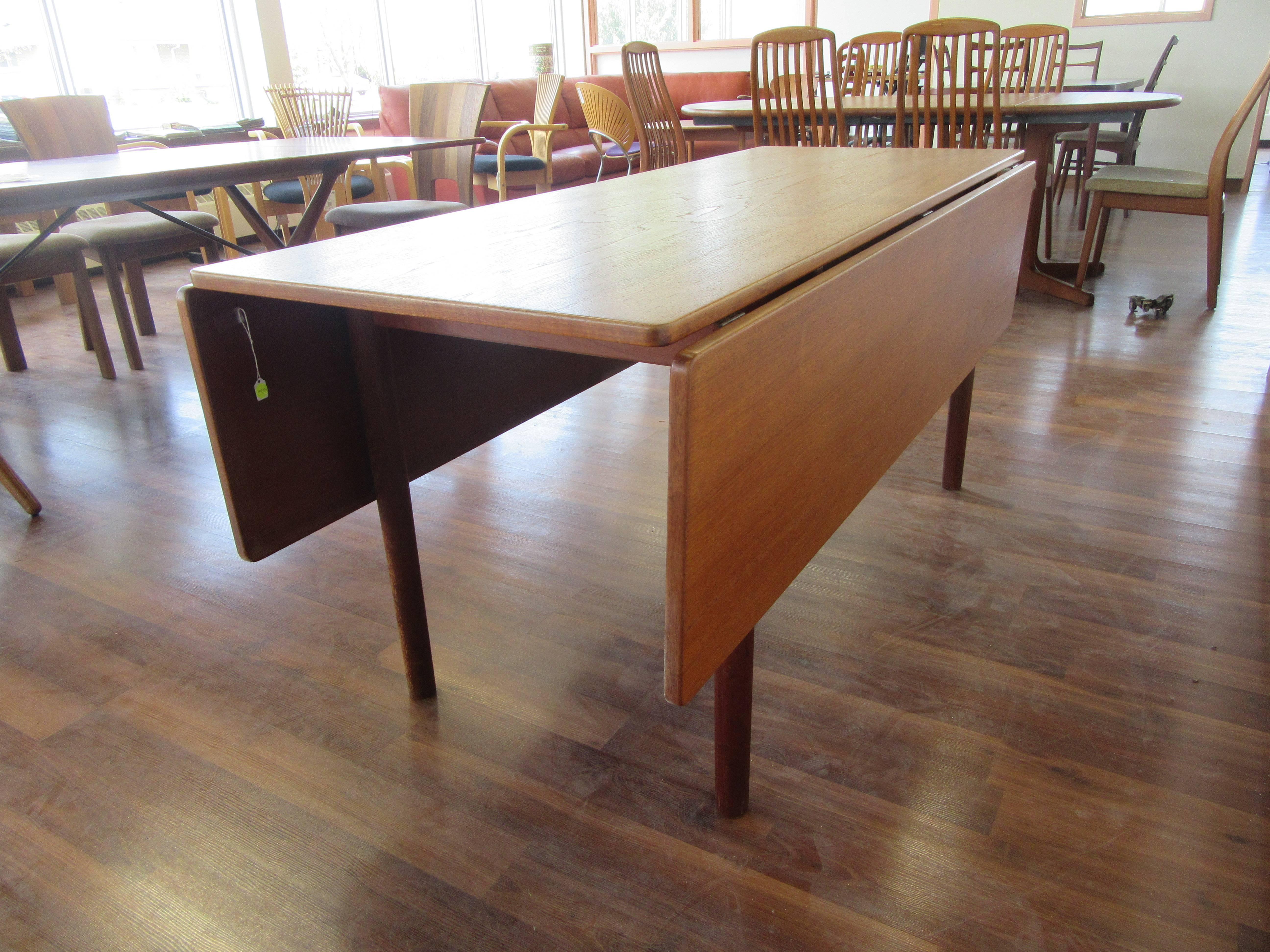 Drop-leaf harvest table in oak by Børge Mogensen from the 1960s. Extensions make this  table into a large square when entertaining, 62.25".