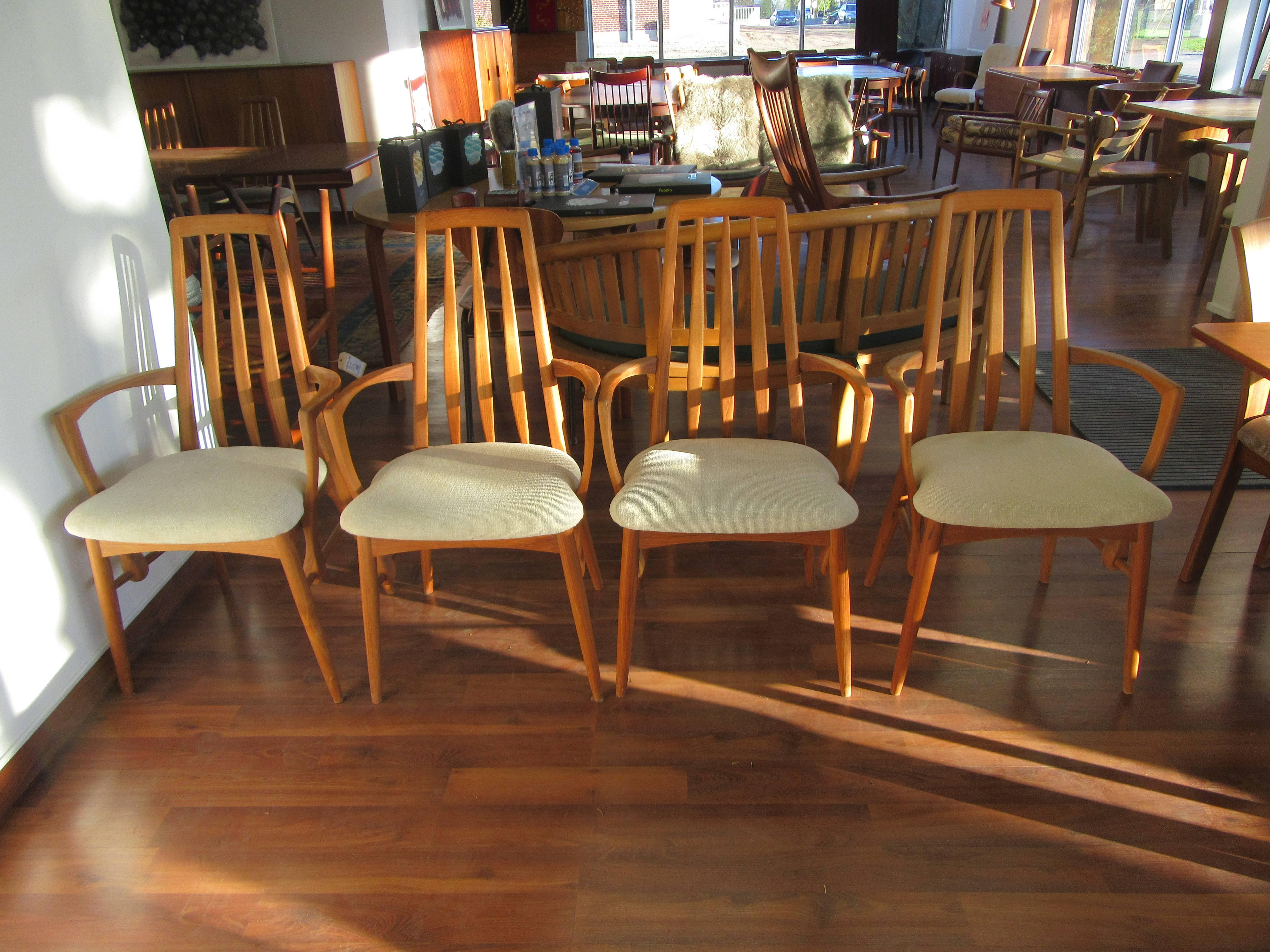 Set of four Eva armchairs in teak.