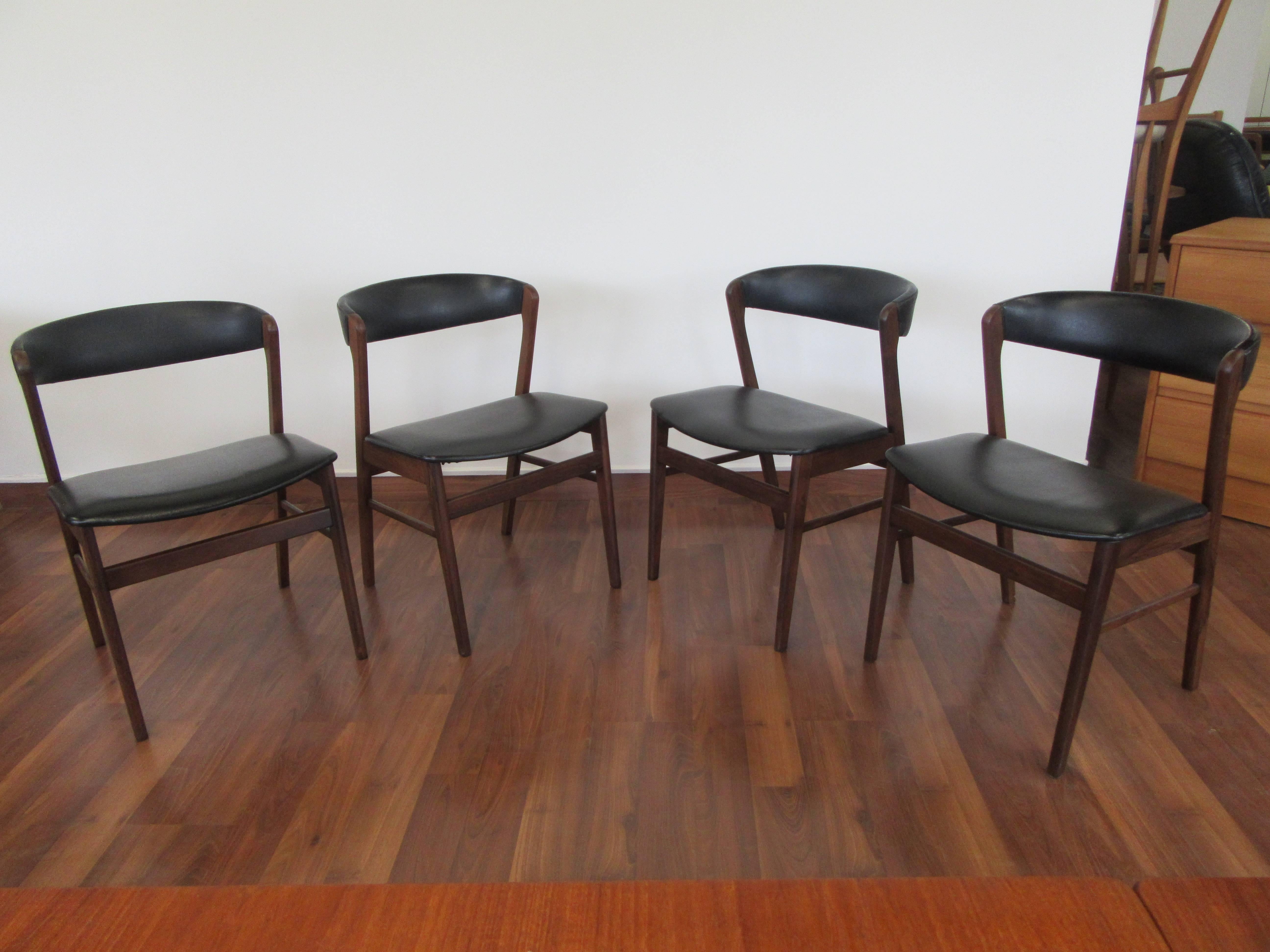 Elegant set of four Kai Kristiansen curved back chairs in rosewood. 