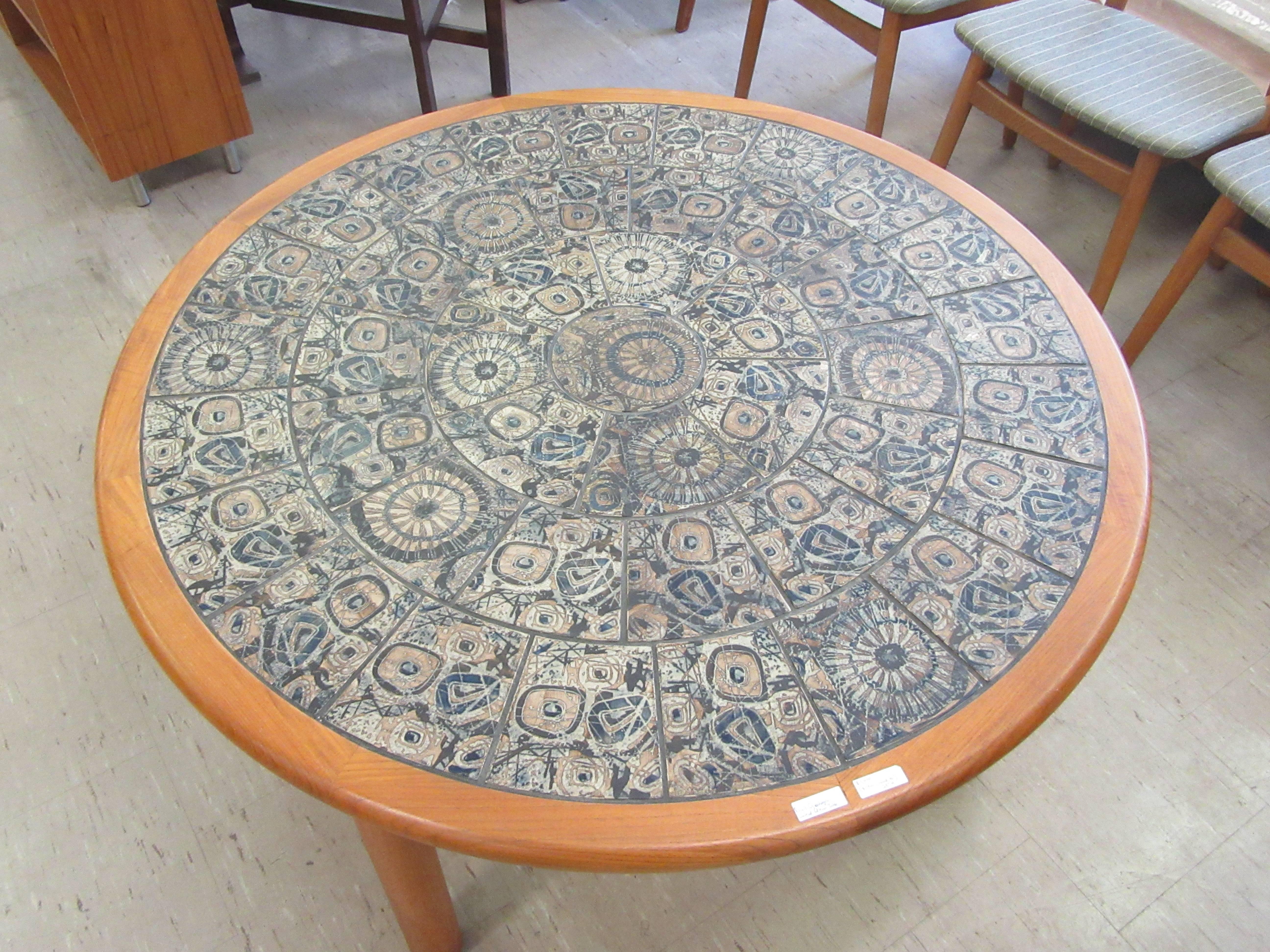 Striking low teak table with Royal Copenhagen ceramic top.