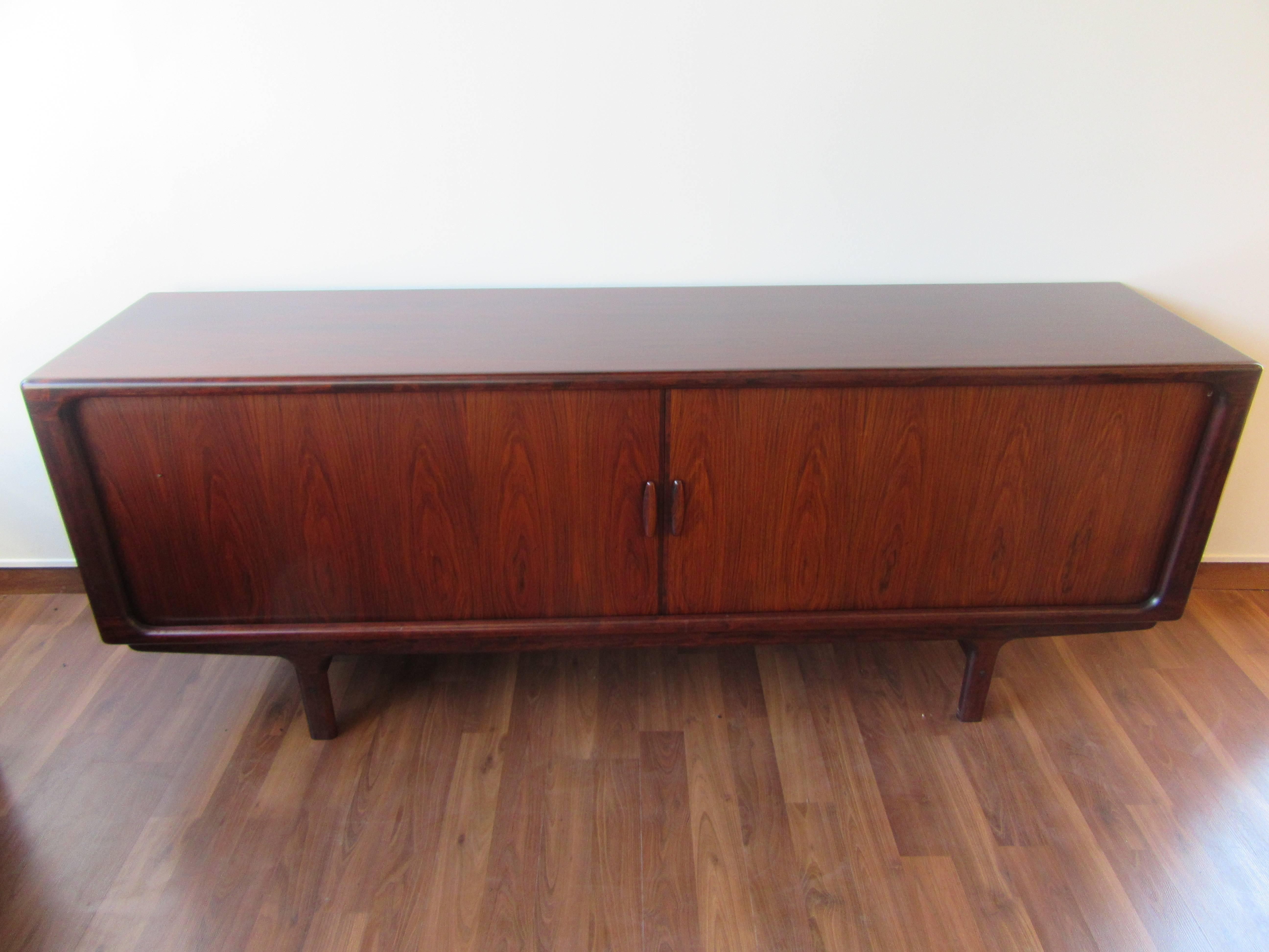 Exceptional rosewood sideboard for Drylund featuring tambour sliding doors.