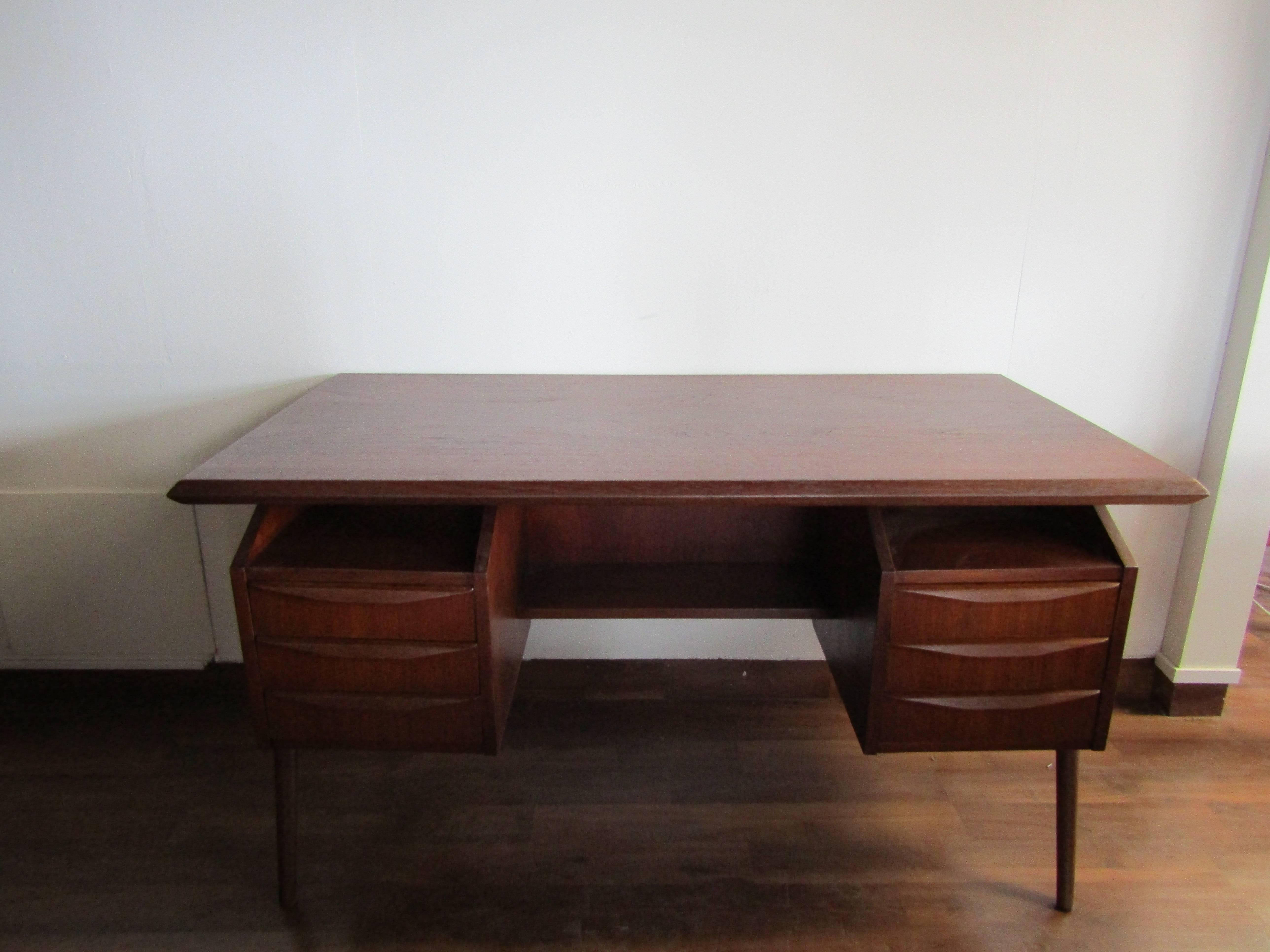 This sleek teak desk from Denmark is perfect for condos or home offices.