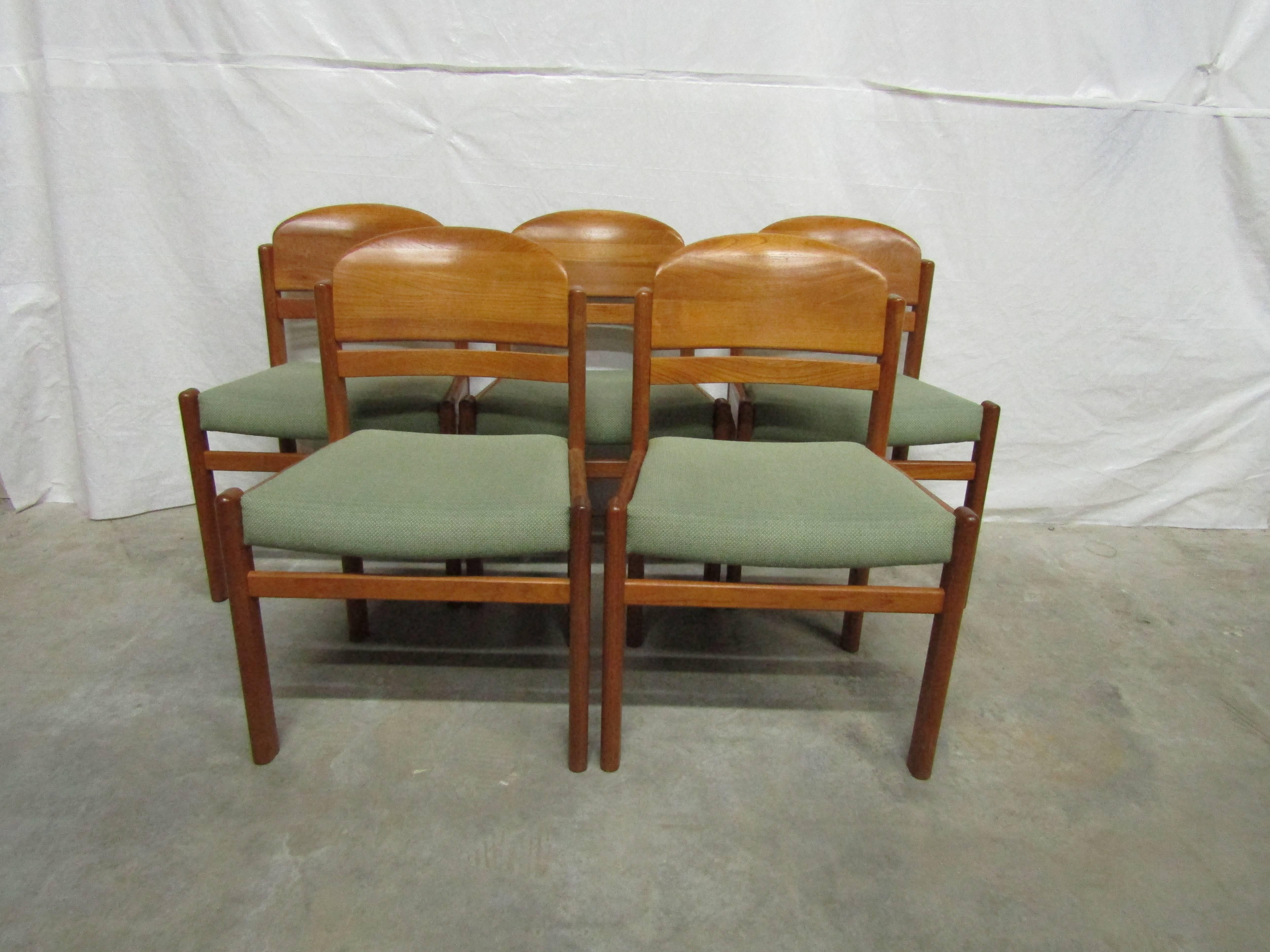 Set of six Danish teak sculptured back dining chairs with green upholstery. 