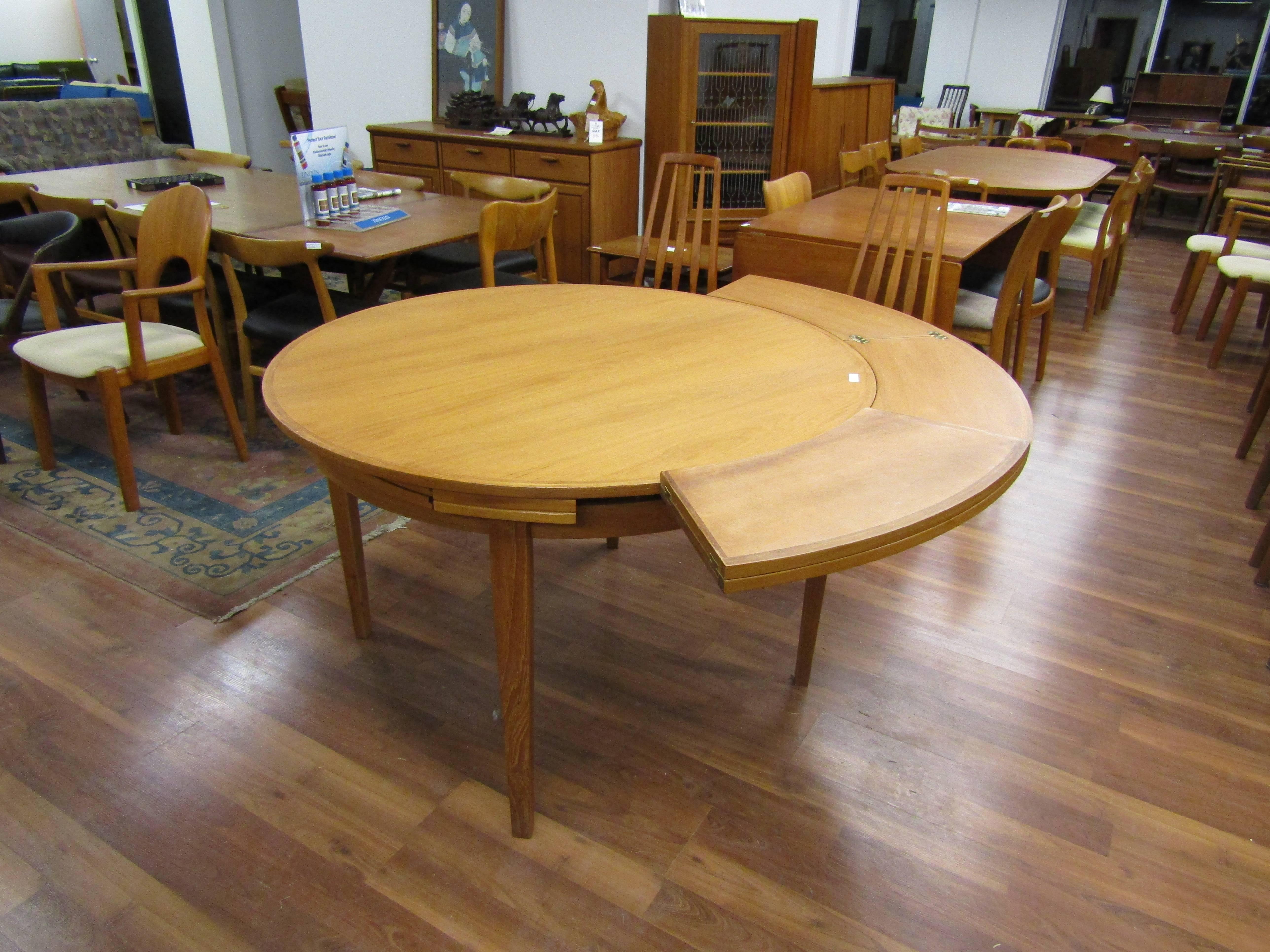 This elegant flip flap and Sophie teak dining table comes from Denmark.
Measure: Leaves hide under the table and extend out 10.75