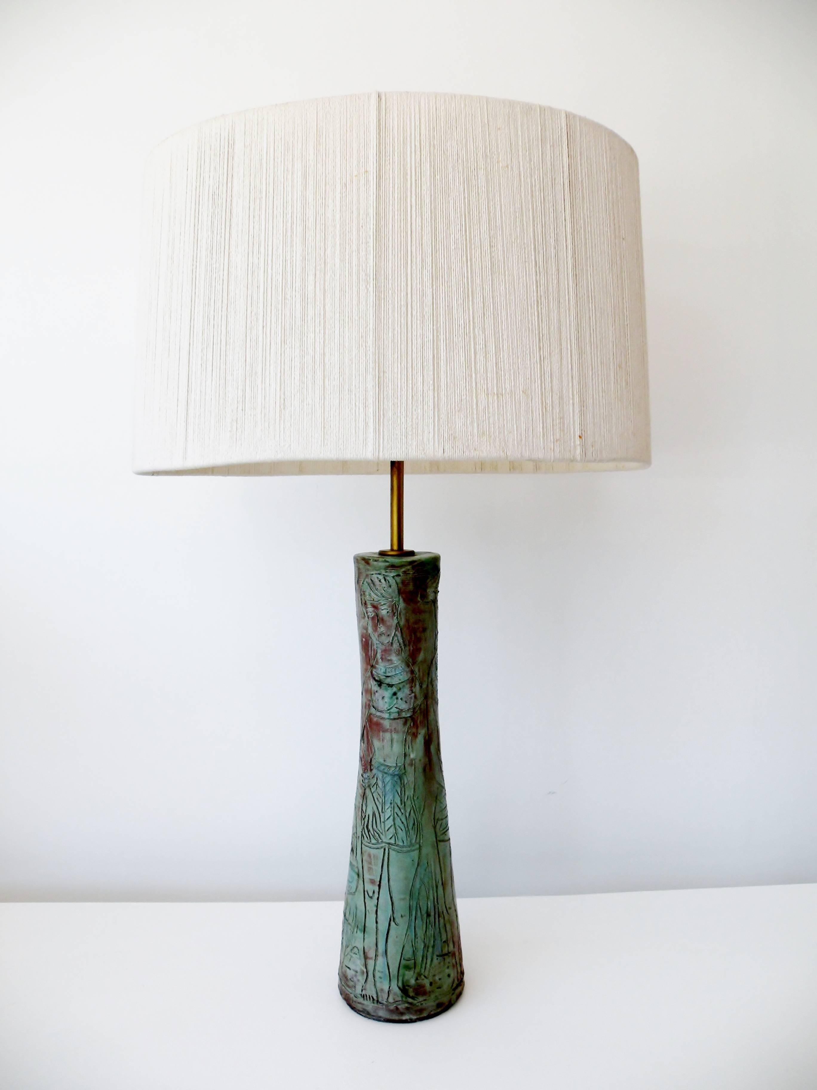 Fine 1950s organic modernist unsigned Studio Pottery table lamp with a sgraffito decoration of abstracted female figures. Body of lamp approximate 18
