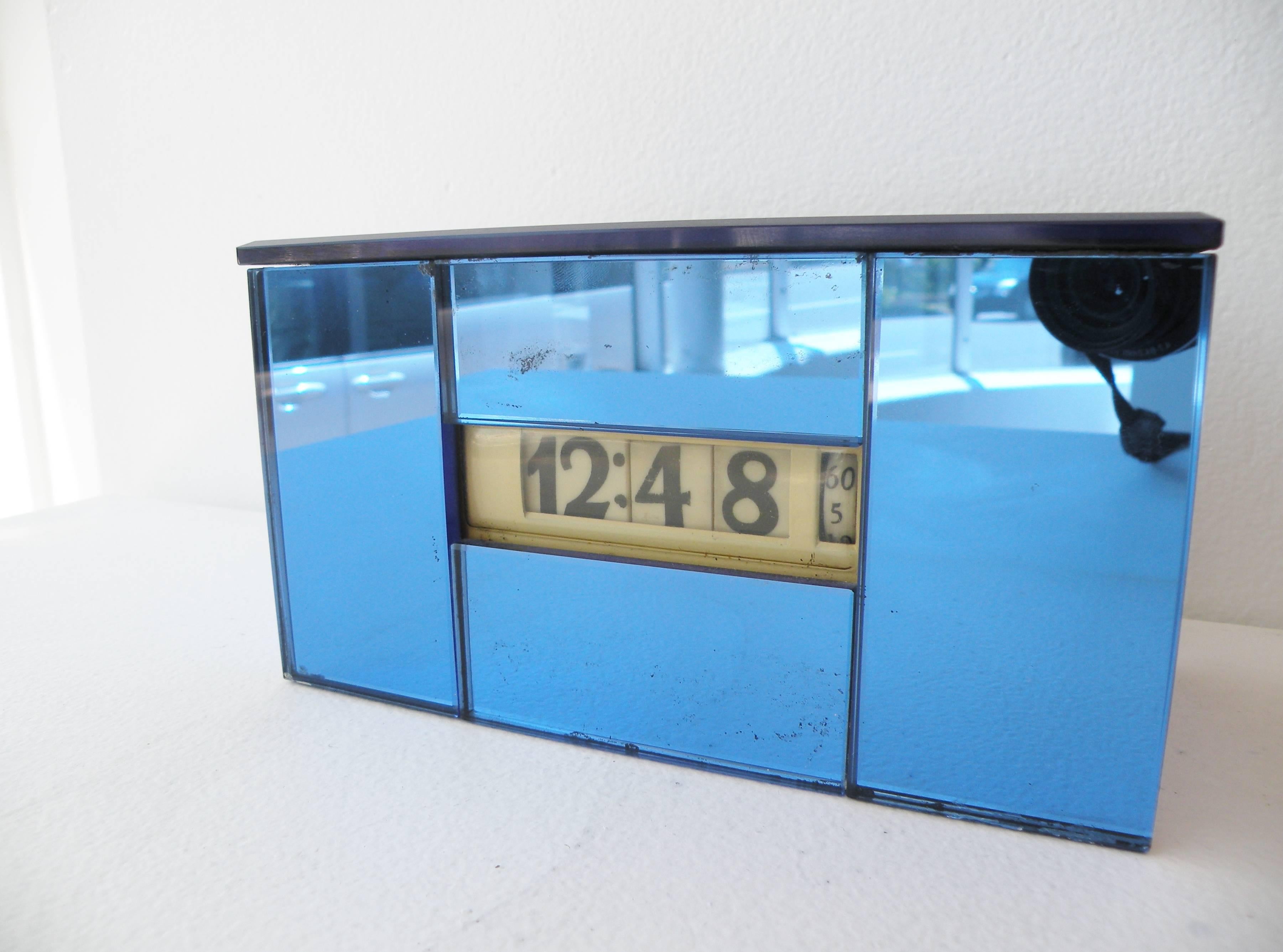 Art Deco 1930s era Lawson Time Inc., Los Angeles, California cyclometer digital table clock model 99 with the scarce blue mirror glass case and chrome plate backplate. Streamline modern lines are often a misattributed design of KEM Weber, current