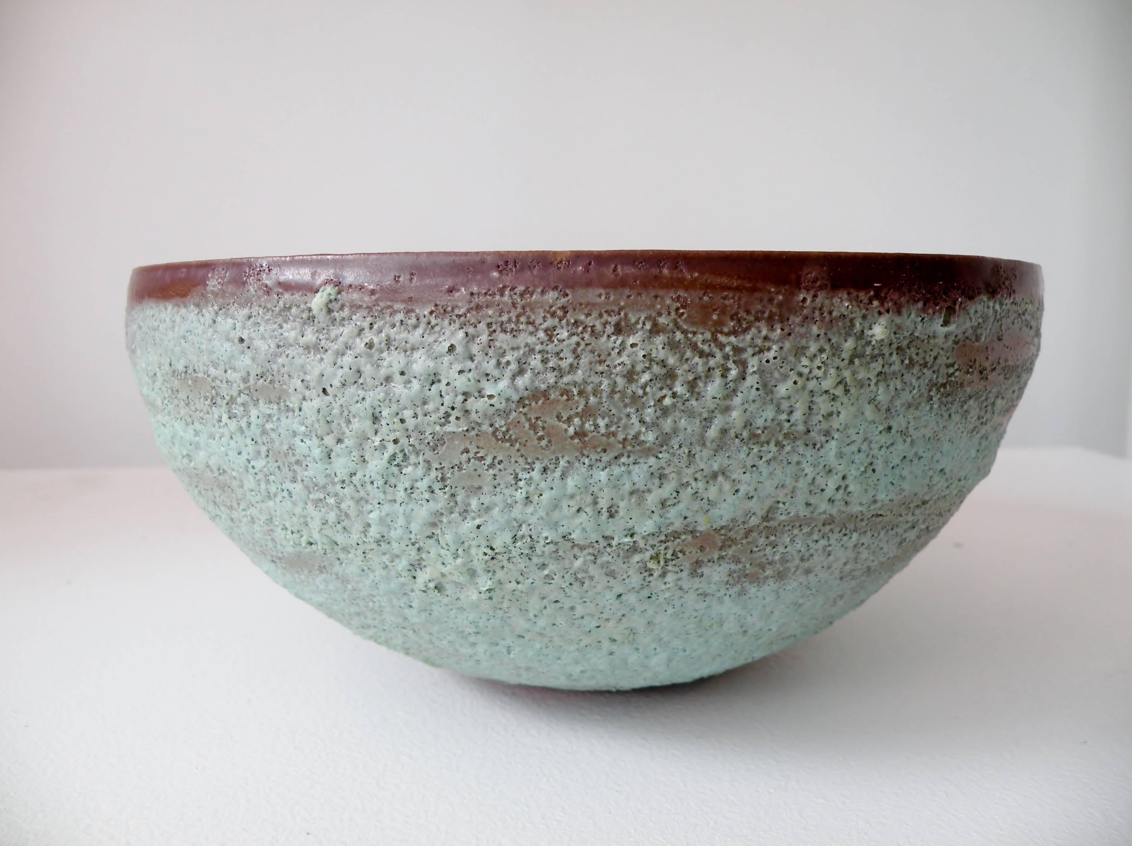 Fine thin walled pottery bowl with verdigris volcanic glaze from renowned Ojai, California potter Beatrice Wood. Approx. 9